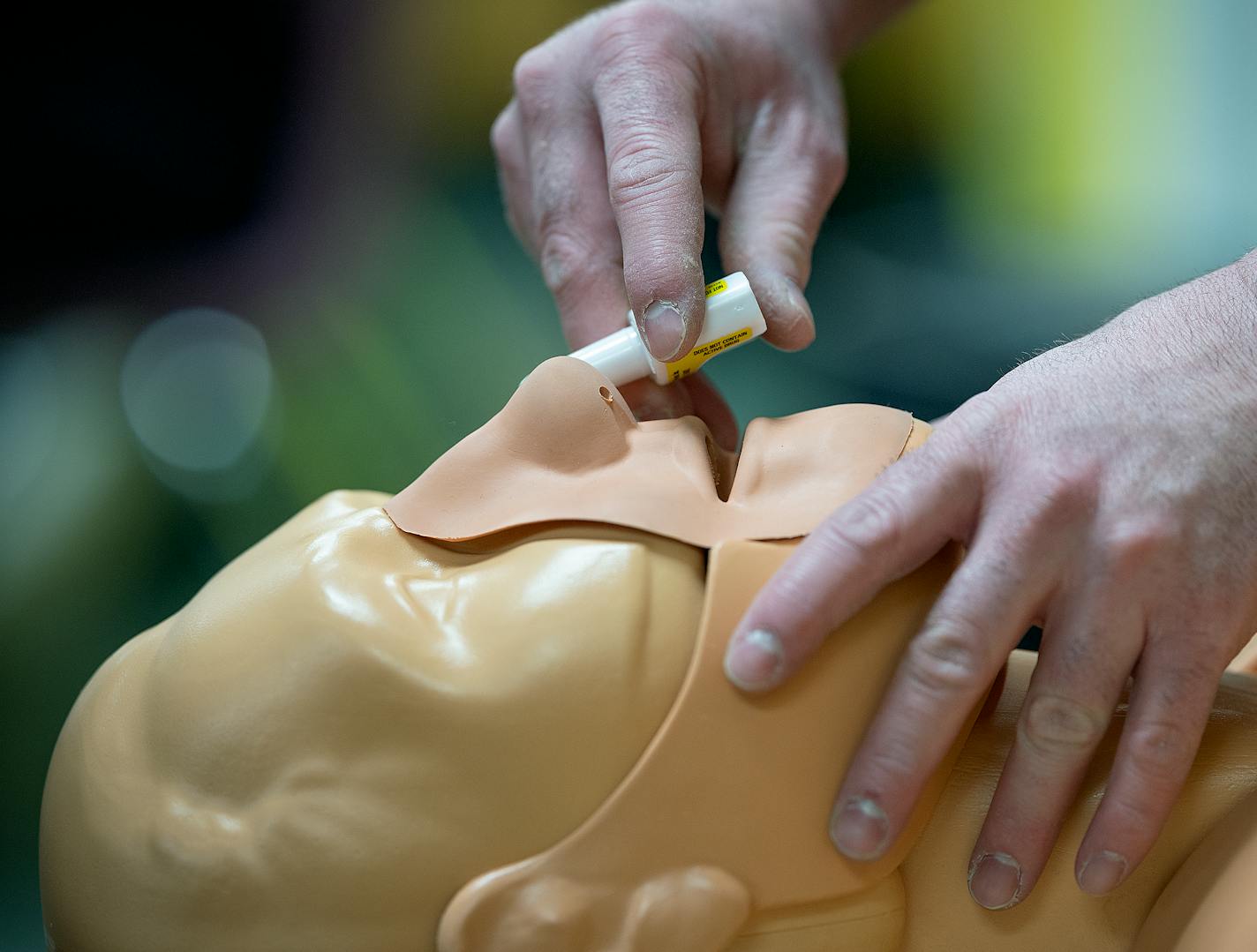 Alex Wenzel, M Health Fairview Community health nurse, demonstrates how to administer nasal naloxone spray to a group of students at Washington Technology Magnet School in St. Paul, Minn., on Thursday, Jan. 11, 2024. ] Elizabeth Flores • liz.flores@startribune.com