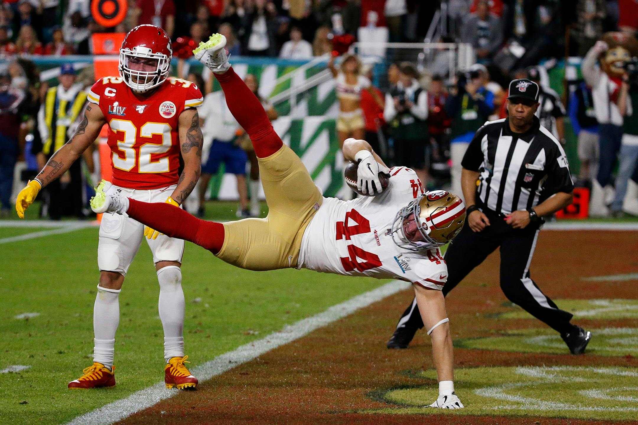 San Francisco 49ers' Kyle Juszczyk (44) falls into the end zone for a touchdown the Kansas City Chiefs during the first half of the NFL Super Bowl 54 football game Sunday, Feb. 2, 2020, in Miami Gardens, Fla.