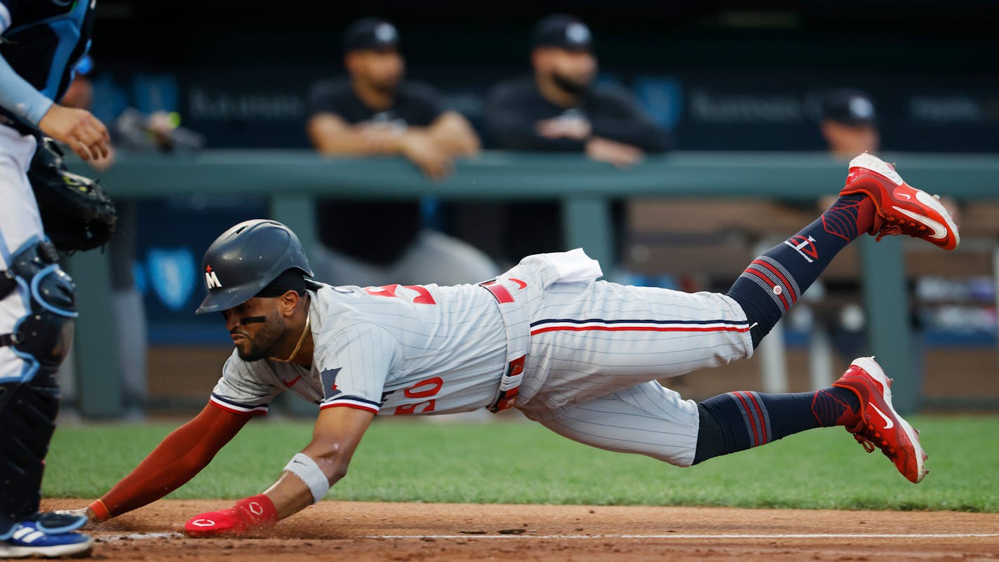 Minnesota Twins' Willi Castro scores from third base on a double steal during the fourth inning of the team's baseball game against the Kansas City Royals in Kansas City, Mo., Friday, July 28, 2023. (AP Photo/Colin E. Braley)