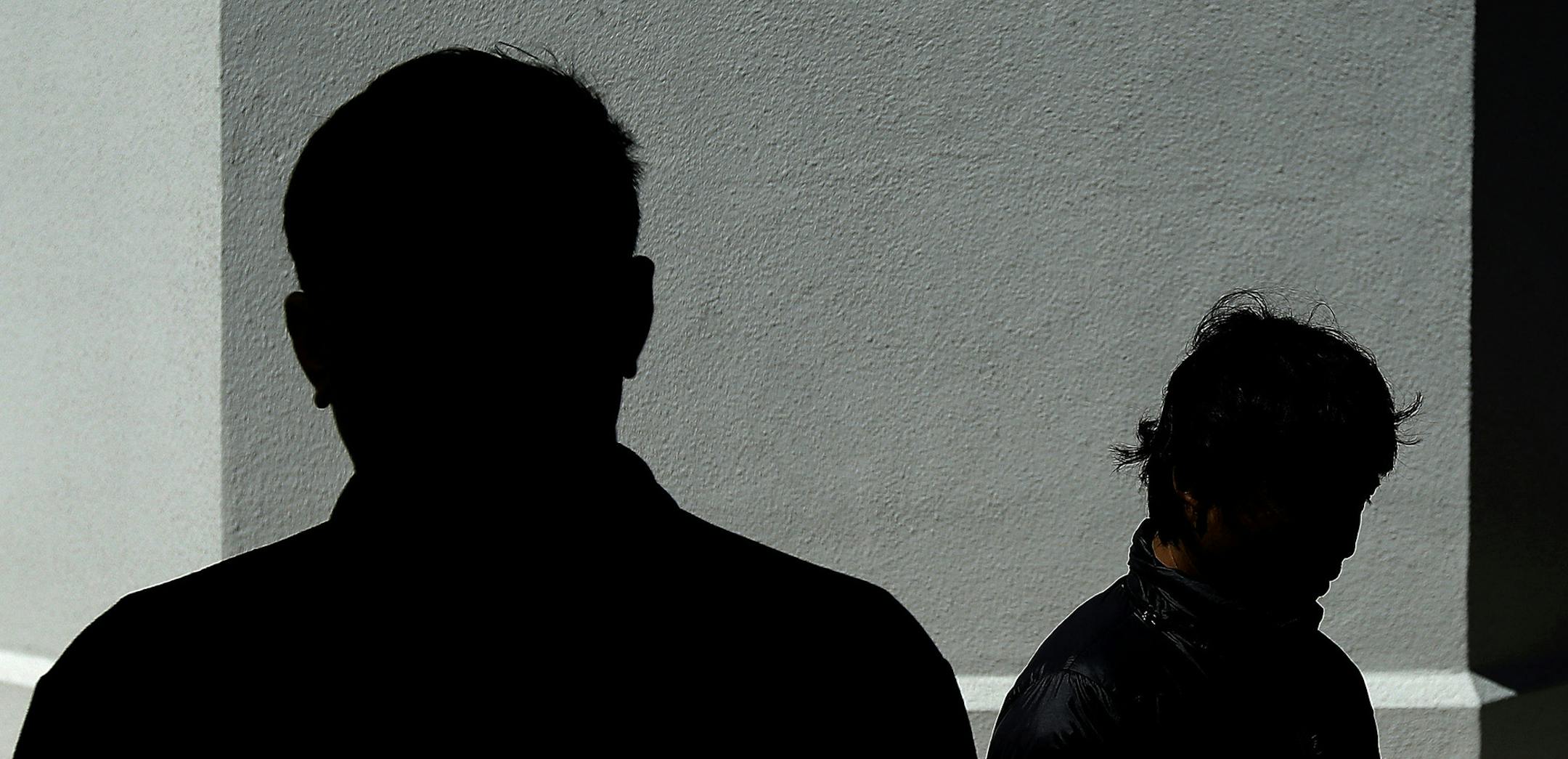 This April 25, 2016 photo shows two foreign fishermen, who had worked aboard an American vessel and are being granted U.S. visas as a victims of human trafficking, in San Francisco. Early one morning when their captain was gone, they broke into their skipper's quarters, grabbed their passports and made a run for it while docked at Fisherman's Wharf. "I knew if I stayed on that boat I was going to die," said one of them. (AP Photo/Jeff Chiu) ORG XMIT: NY753