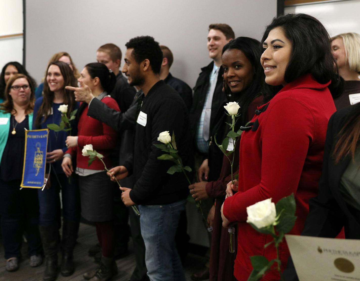 Maya Tackaberry, in red, posed for a photo with fellow inductees following an induction ceremony to the Pi Beta Kappa honor society Thursday. ] ANTHONY SOUFFLE &#xef; anthony.souffle@startribune.com For the first time ever, The Women's Foundation of Minnesota has awarded grants to individuals--promising young women with ideas that will help other women and girls. Microgrant recipient Maya Tackaberry attended an induction ceremony for the Pi Beta Kappa honor society Thursday, April 13, 2018 at St