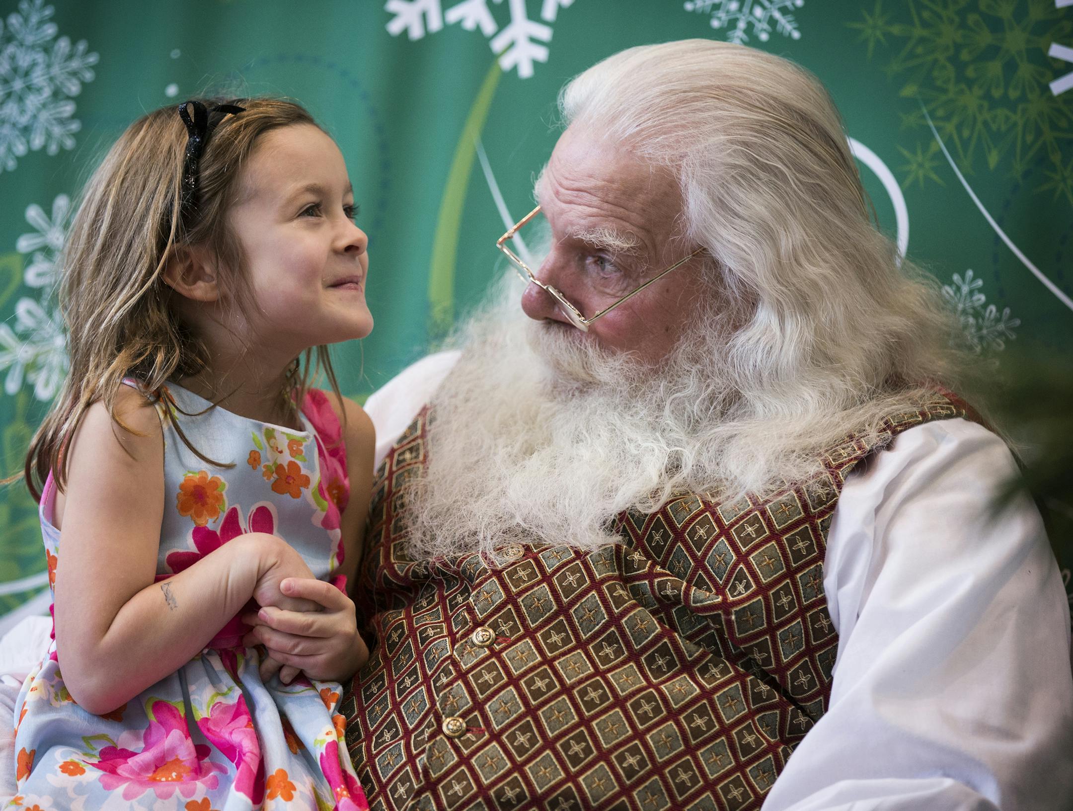 Elizabeth Peters, 6, of Minneapolis talks with Santa (who would not give his real name) at Southdale Center in Edina on Thursday, December 24, 2015. ] (Leila Navidi/Star Tribune) leila.navidi@startribune.com