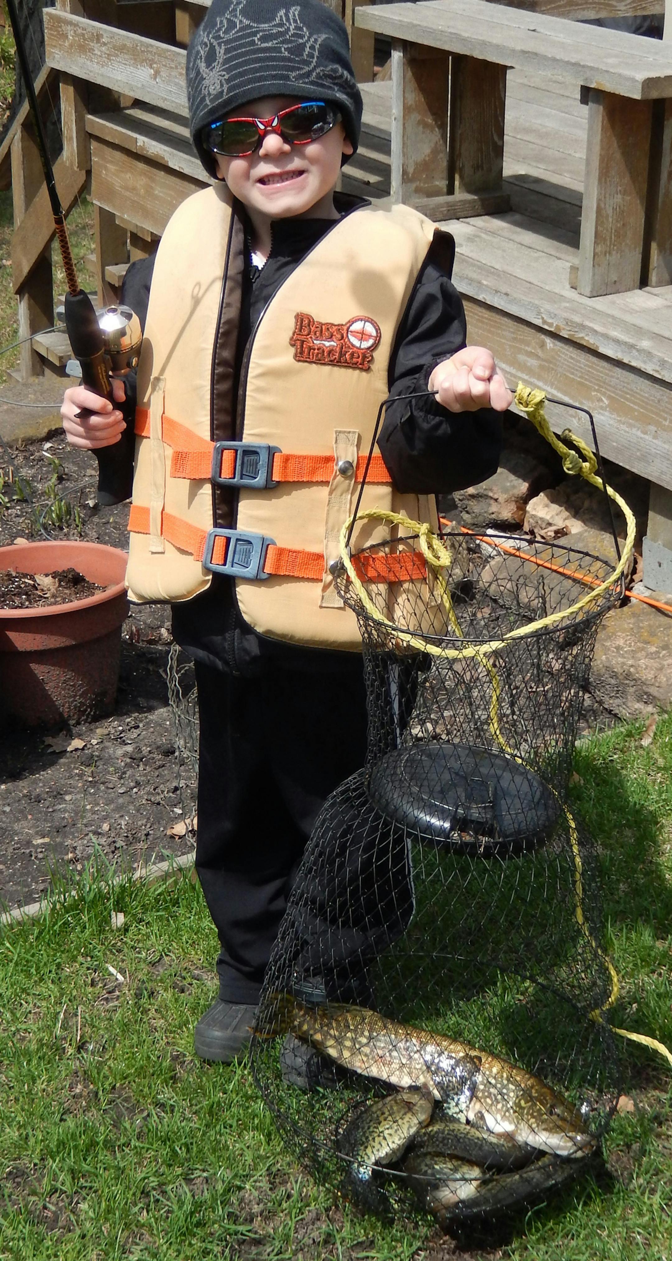 Chase Risic, 6, of Tonka Bay, with four crappies and a northern he and his grandpa, Rick Zweig of Excelsior, caught on Lake Minnewashta on the fishing opener.