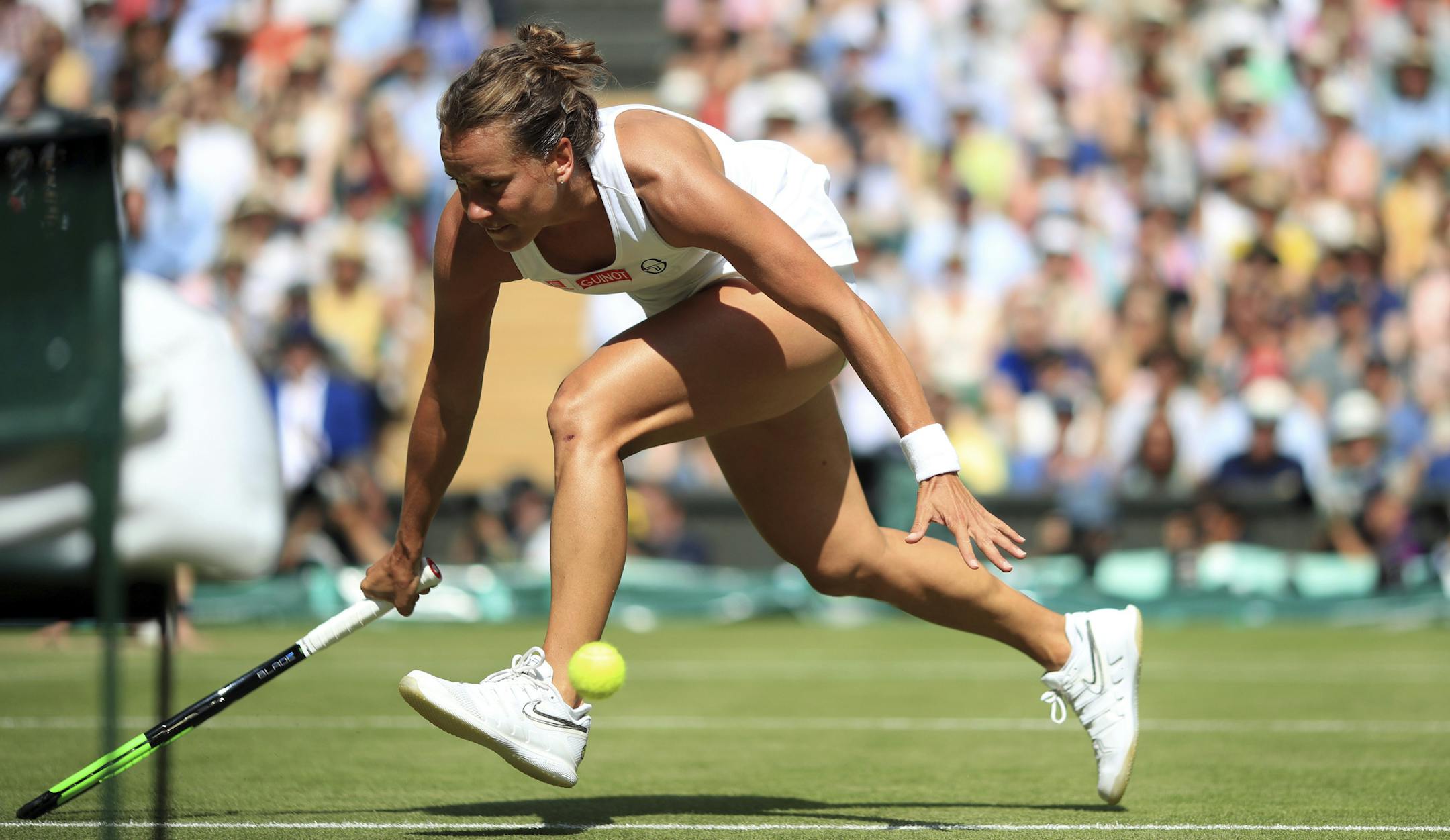 Czech Republic's Barbora Strycova overruns the ball as she tries to return to United States' Serena Williams in a Women's semifinal singles match on day ten of the Wimbledon Tennis Championships in London, Thursday, July 11, 2019. (Adam Davy/Pool Photo via AP)