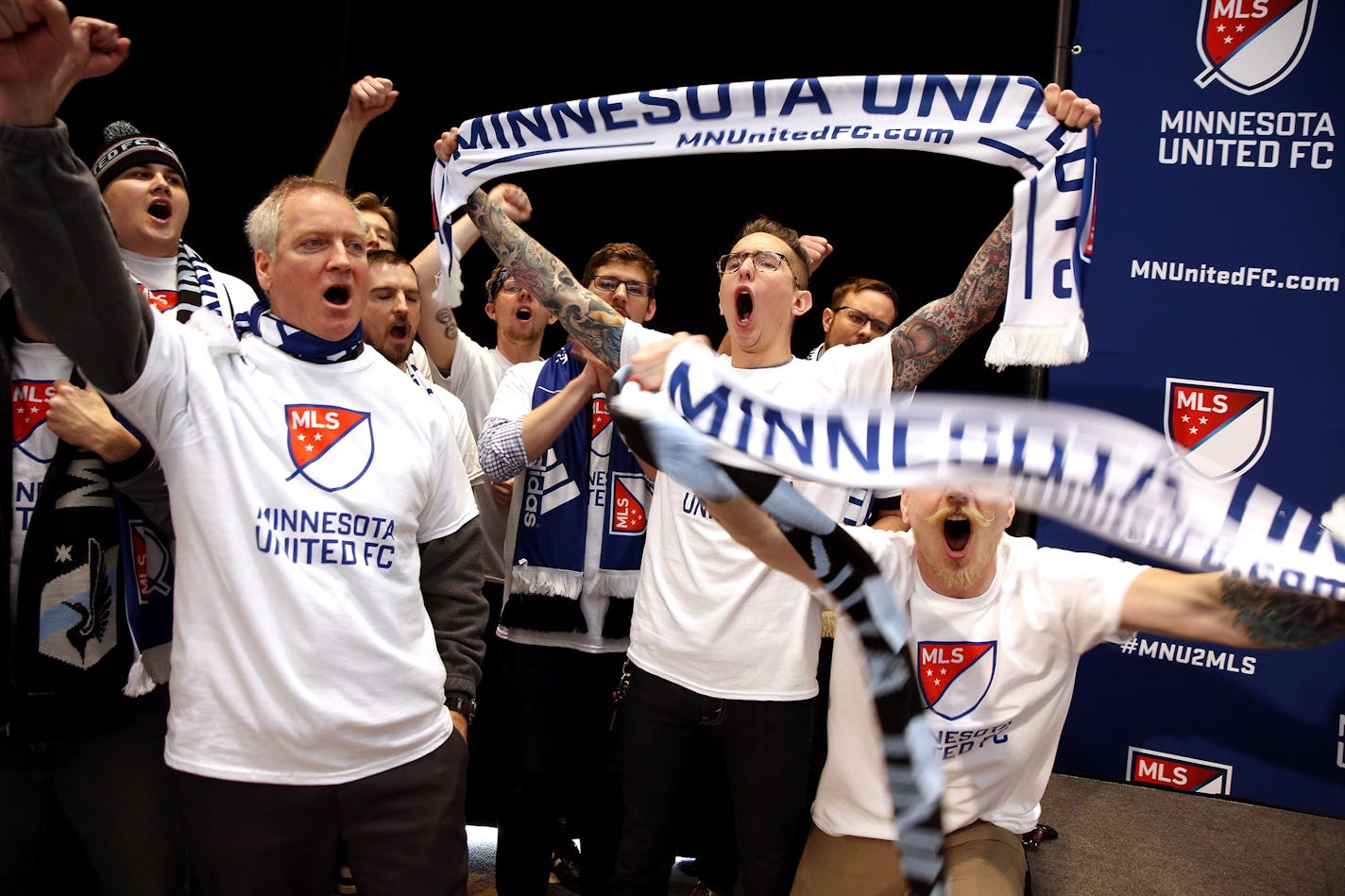 Minnesota Untied FC fans cheer after a press conference with Major League Soccer Commissioner Don Garber and Dr. Bill McGuire announcing that the team will move to the MLS at Target Field in Minneapolis on Wednesday, March 25, 2015. ] LEILA NAVIDI leila.navidi@startribune.com /