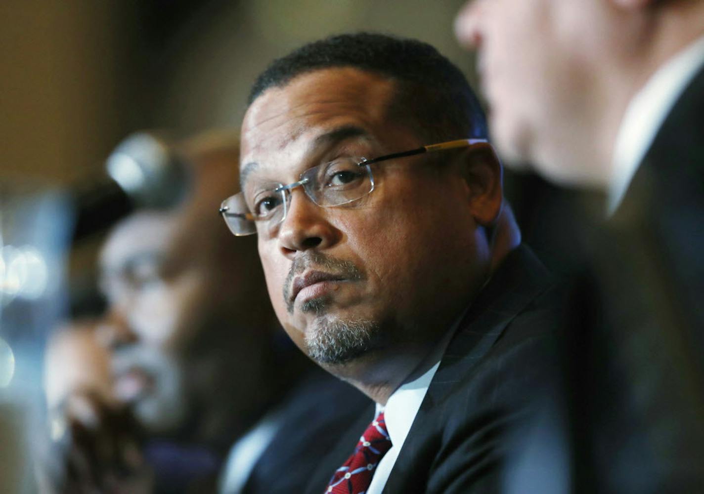 FILE - In this Dec. 2, 2016 file photo, U.S. Rep. Keith Ellison, D-Minn., listens during a forum on the future of the Democratic Party, in Denver. Ellison, who is currently running to be the next chair of the Democratic National Committee, announced Monday, Jan. 16, 2017, he is boycotting Donald Trump's presidential inauguration on Friday. (AP Photo/David Zalubowski, File)