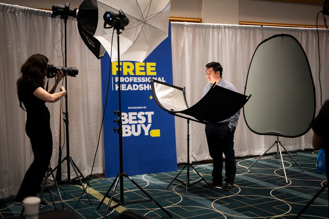 Peng Yang gets a headshot taken at the Best Buy sponsored free headshot booth during the annual People of Color Career Fair at the Minneapolis Convention Center on Wednesday April 24, 2024 in Minneapolis, Minn.
