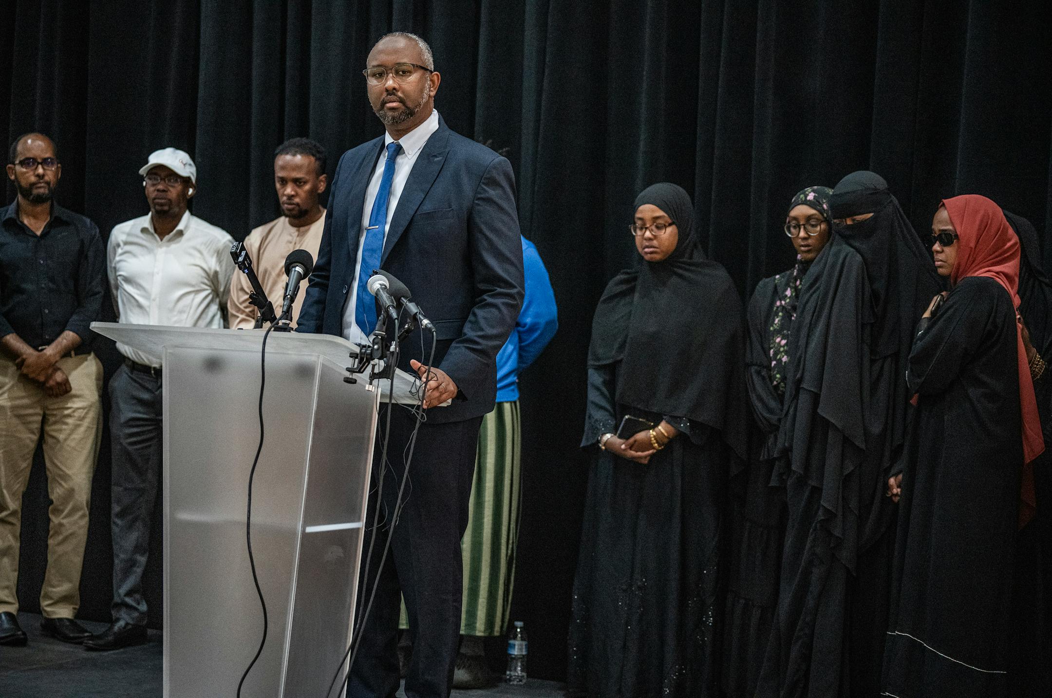 Jaylani Hussein of Cair-Minnesota with female relatives of of the crash that killed five in Minneapolis are calling for an independent investigation in Bloomington, Minn., on Monday, June 26, 2023. CAIR-MN is calling for an independent investigation of the crash that killed five in Minneapolis.