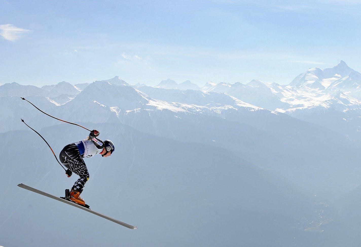 American Lindsey Vonn is airborne during the slalom event in the women's super combined at the FIS alpine skiing World cup on March 9, 2008 in Crans-Montana. Anja Paerson of Sweden won the super combined event edging out Germany's Maria Riesch and American Lindsey Vonn. Riesch, who placed second, won the World Cup super-combined title. Background of the image shows the Swiss alps. AFP PHOTO / Fabrice Coffrini