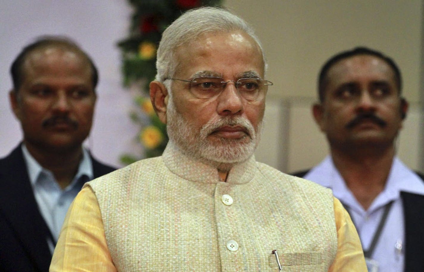 India's next prime minister and Hindu nationalist Bharatiya Janata Party (BJP) leader Narendra Modi attends the swearing in ceremony of the new Chief Minister of Gujarat state Anandiben Patel in Gandhinagar, India, Thursday, May 22, 2014. Patel, who was Thursday sworn in as the first female Chief Minister of Gujarat state, succeeds Narendra Modi, who resigned Wednesday as he set out to become India's new prime minister. (AP Photo/Ajit Solanki) ORG XMIT: MIN2014052312581008