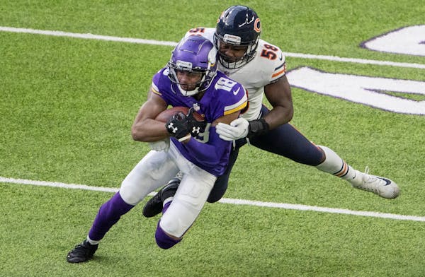 Minnesota Vikings receiver Justin Jefferson (18) was tackled by Roquan Smith (58) of the Chicago bears in the third quarter.