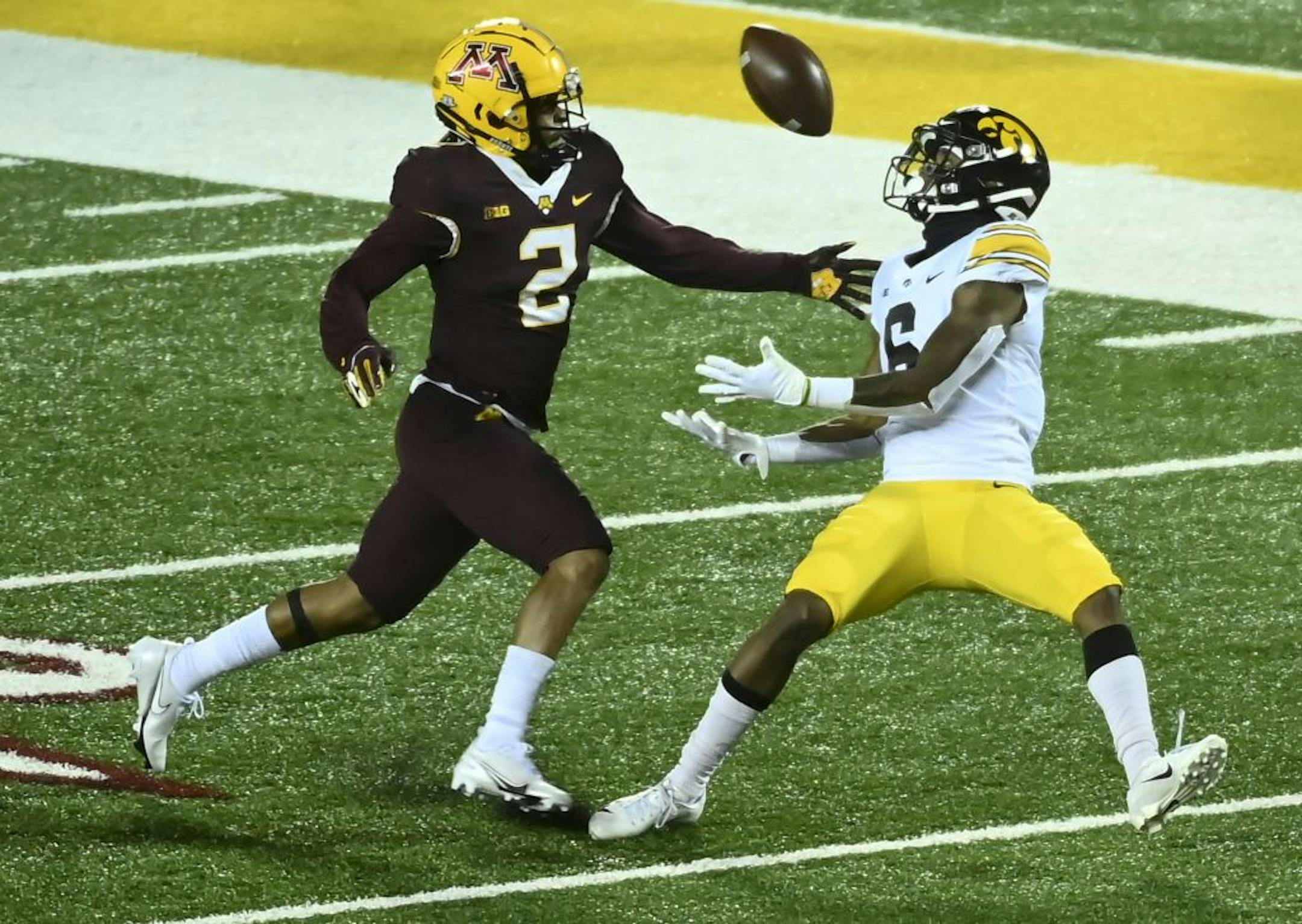Iowa Hawkeyes wide receiver Ihmir Smith-Marsette (6) was unable to complete a pass as he was defended by Minnesota Gophers defensive back Phillip Howard (2) in the third quarter.