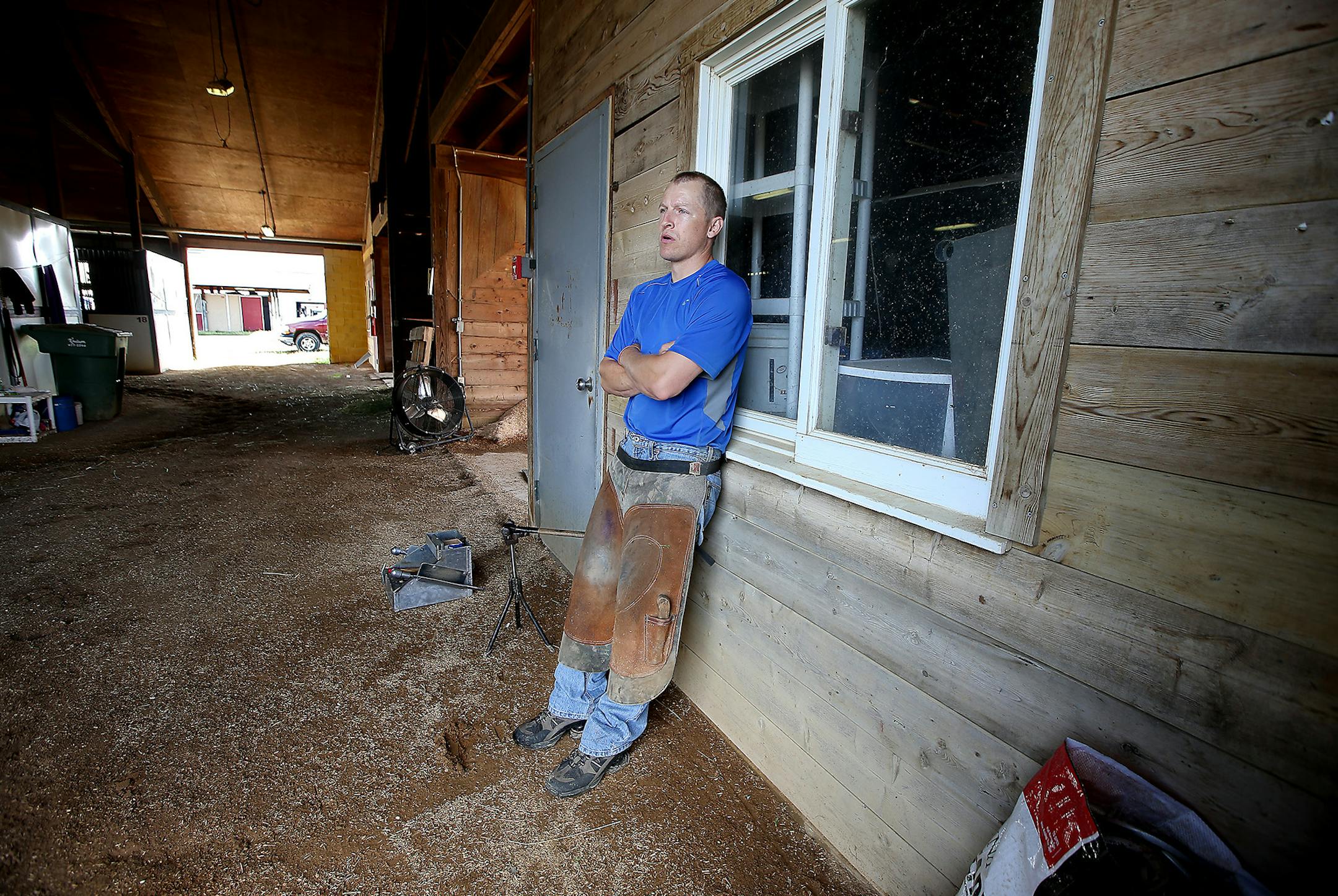 Horseshoer Scott Rhone waited in a barn to work on a horse at Canterbury Park, Wednesday, June 15, 2016 in Shakopee, MN. ] (ELIZABETH FLORES/STAR TRIBUNE) ELIZABETH FLORES • eflores@startribune.com