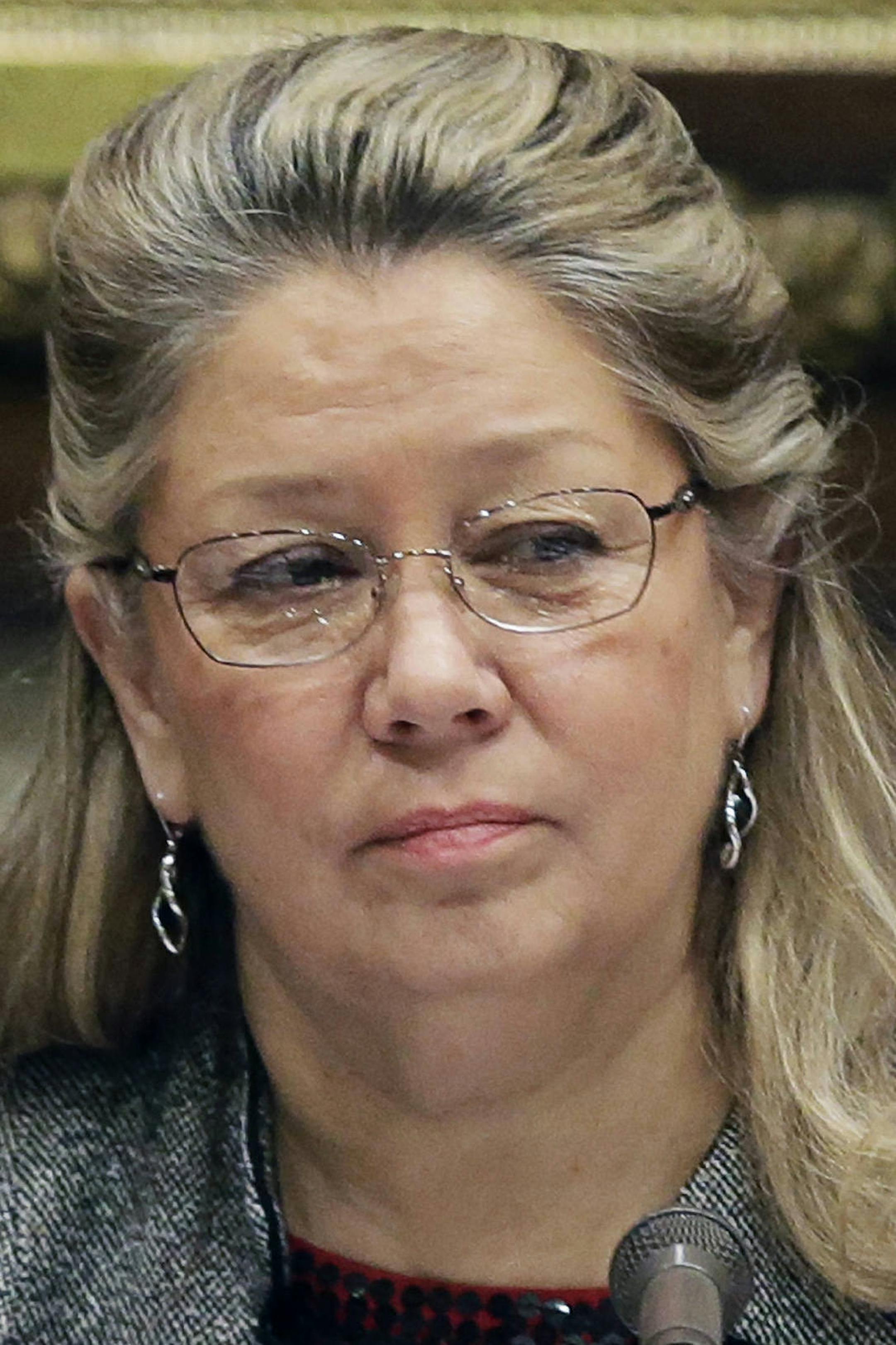 In this Nov. 26, 2013, photo, Minnesota Lt. Gov. Yvonne Prettner Solon chairs a gun hearing at the State Capitol in St. Paul, Minn. Solon was to meet Monday, Jan. 13, 2014, with Gov. Mark Dayton about whether she'll join him in a re-election run. (AP Photo/Jim Mone)