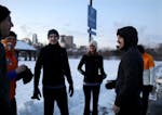 J.C. Lippold, right, chats with fellow runners before they headed out for conversation and an early morning run from Boom Island Park in sub zero temp