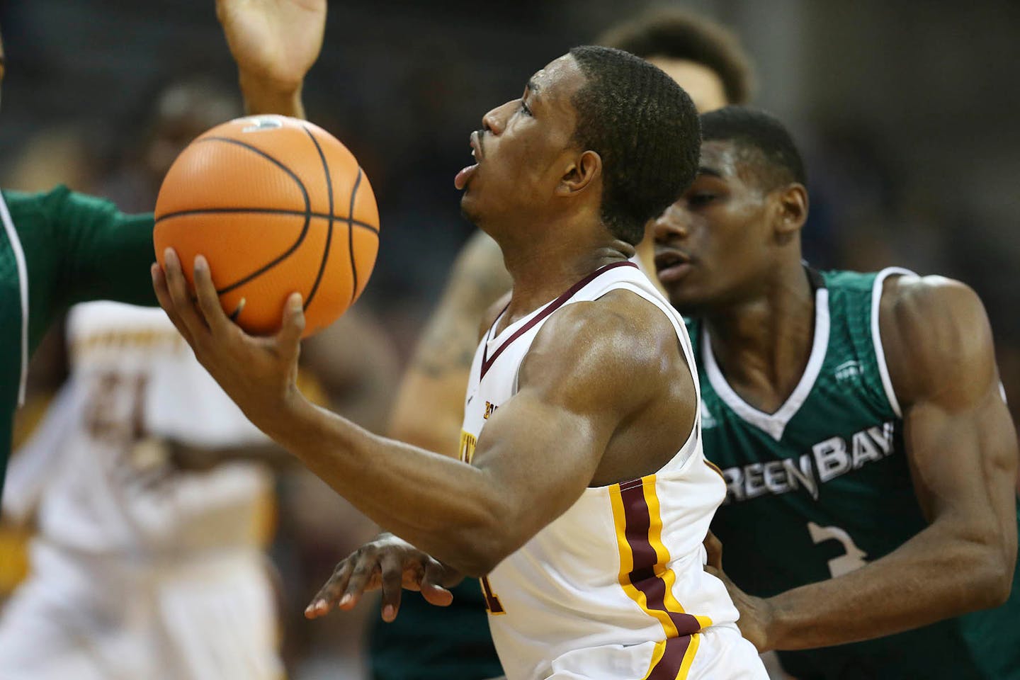 Isaiah Washington drove to the basket during an exhibition game vs. UW-Green Bay, for hurricane relief for Puerto Rico at the Sports Pavilion Sunday November 5, 2017.