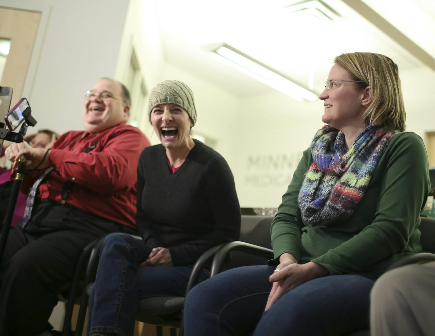 The patients sharing stories at a news conference cracked up Monday afternoon after Siri interjected a comment from a reporter's iPhone after Jessica Blake, center, answered a question at the Minnesota Medical Solutions Patient Center. At left was Patrick McClellan. At right were Sarah Wellington and David Dailey. ] JEFF WHEELER &#xef; jeff.wheeler@startribune.com Patients and clinicians reflected on the first six months of Minnesota's medical marijuana program. Patients shared their personal tr