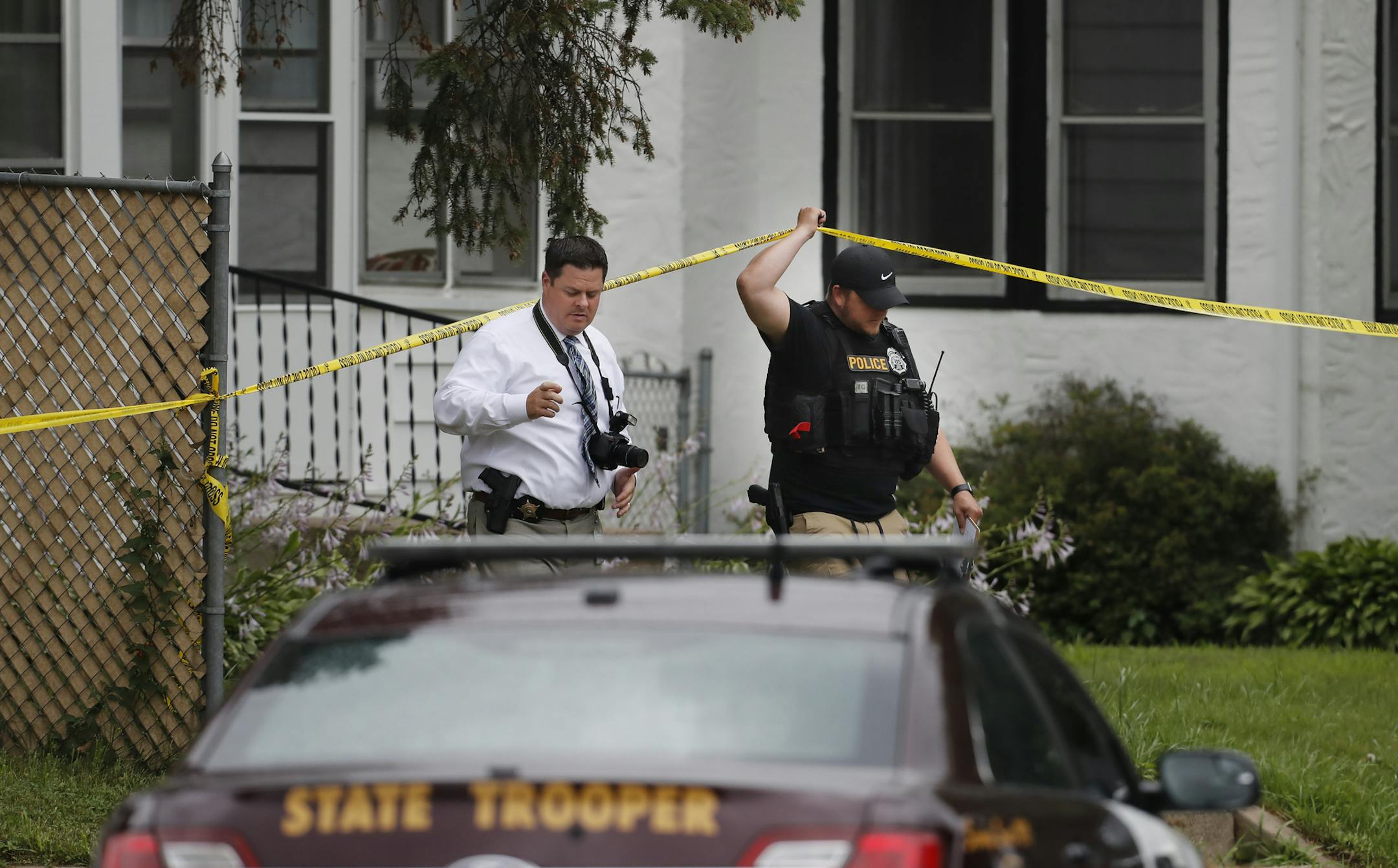 Police officers investigated the scene of a shooting between a suspect and a South St. Paul police officer in South St. Paul, Minn., Thursday, July 19, 2018.