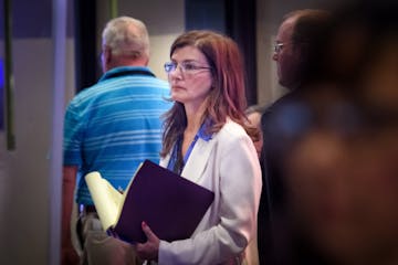 Attorney Michele MacDonald waited in the back of the convention hall before the convention debated whether she would be allowed to speak. She hoped to