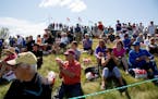 People watch golfers on the first tee at the 3M Championships in Blaine last year.