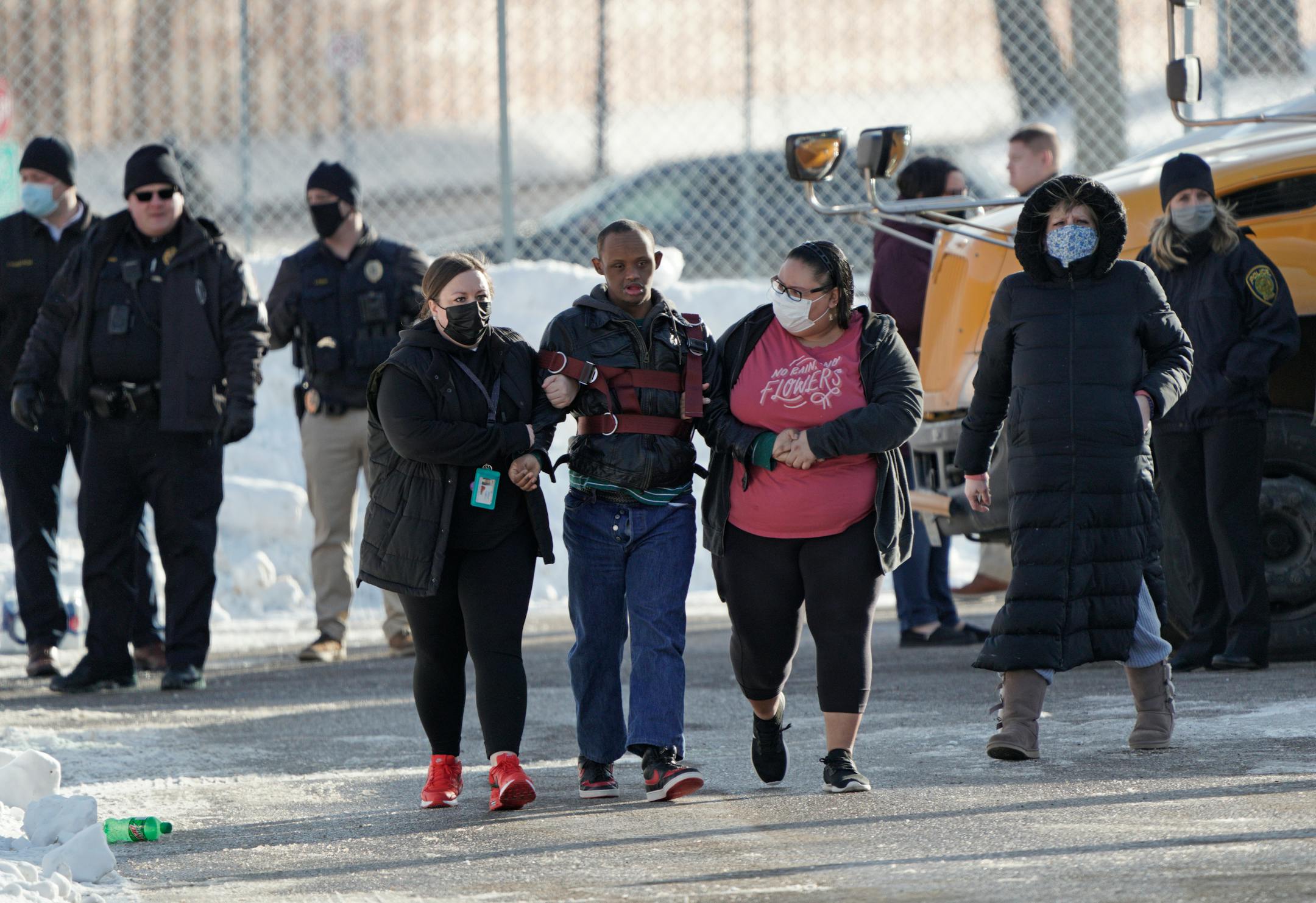 One student was shot and killed, and another severely wounded on the sidewalk outside the South Education Center, an alternative school in the Intermediate District 287 that serves students from pre-K to age 21. Here, students reunite with parents and caregivers after the school was locked down for a few hours Tuesday, Feb. 1, 2022 in Richfield, Minn. ] Brian Peterson ¥ brian.peterson@startribune.com
