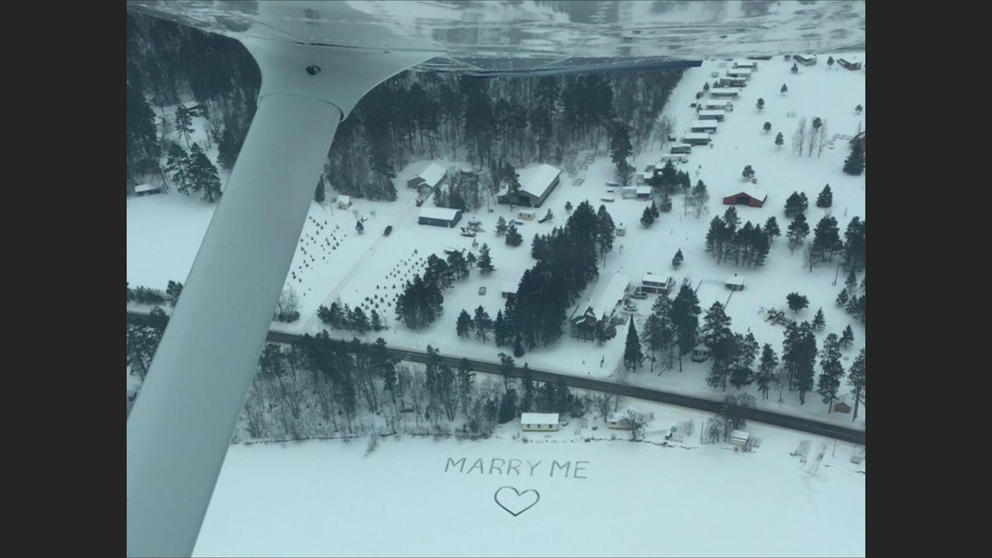 A snow proposal over Eighth Crow Wing Lake near Nevis, Minn.