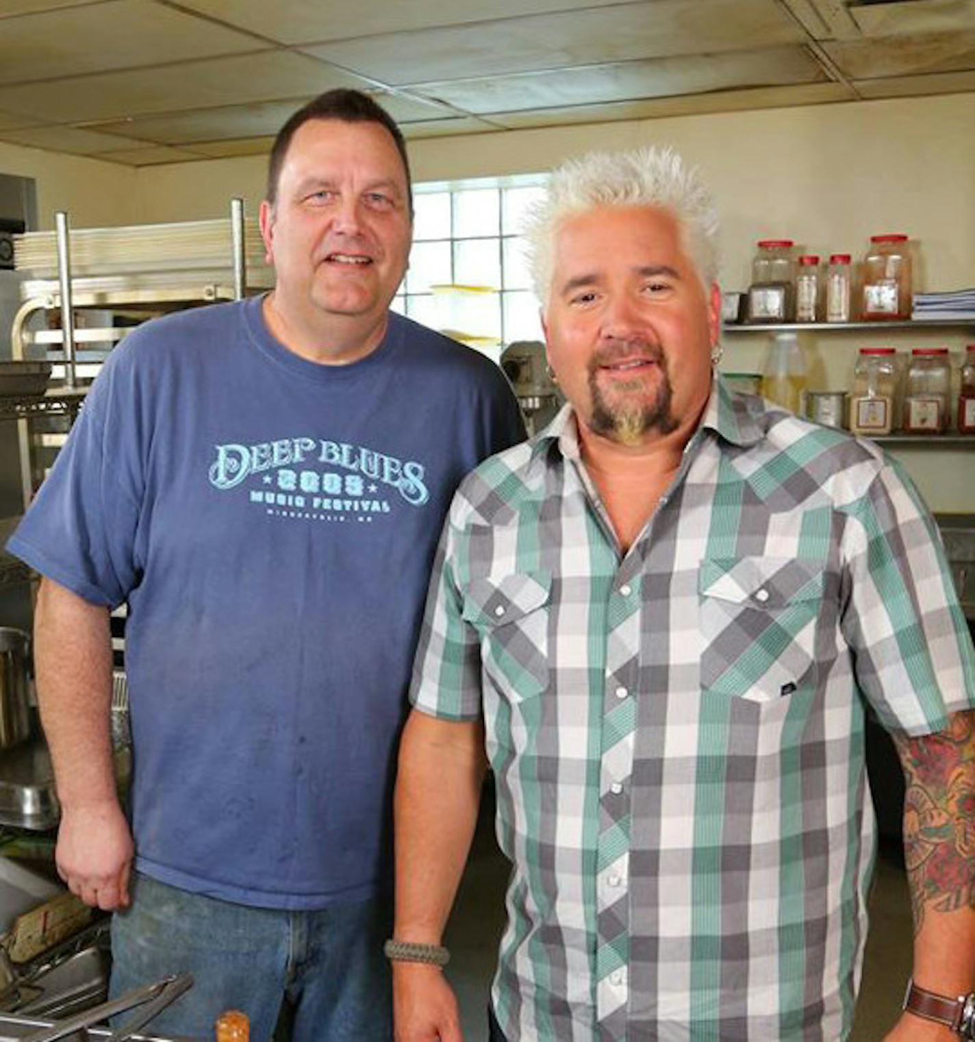 Bayport BBQ owner Chris Johnson with &#xec;Dinvers, Drive-Ins & Dives&#xee; host Guy Fieri, attached, courtesy Bayport BBQ. ORG XMIT: QbxMiShiF6LGogwTsDhJ