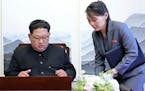 FILE - In this Friday, April 27, 2018, file photo, North Korean leader Kim Jong Un signs a guestbook next to his sister Kim Yo Jong, right, inside the