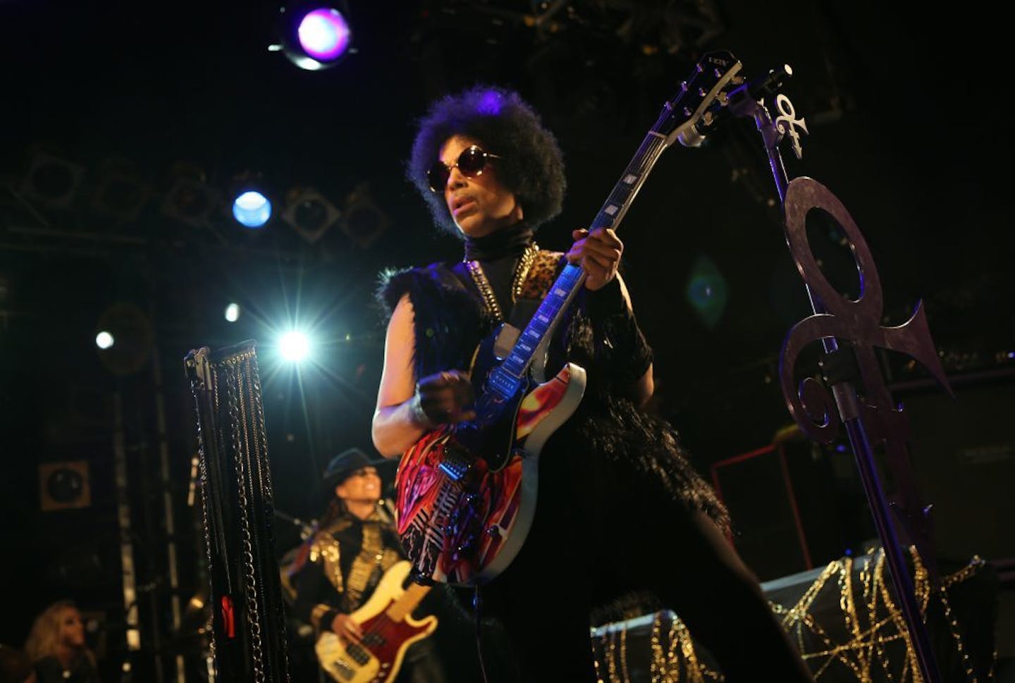 This photo taken on Tuesday Feb. 5, 2014 and released by 3RDEYEGIRL NPG Records on Wednesday Feb. 5, 2014, shows Prince performing in London. The enigmatic star flew into London on Tuesday at the start of a still-evolving string of dates in support of forthcoming album "Plectrum Electrum," recorded with all-female trio 3RDEYEGIRL. Details are being released in a trickle, but Prince said he planned to play "iconic" venues along the lines of music club the Bag o' Nails � where Jimi Hendrix once pl