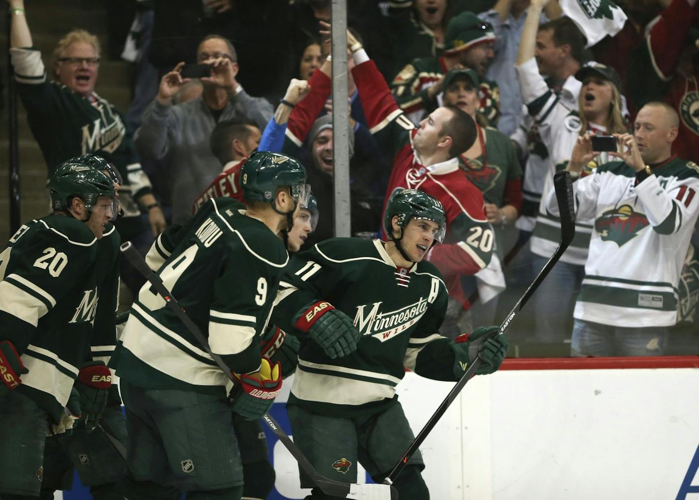 Minnesota Wild left wing Zach Parise (11) heads for the glass to celebrate what proved to be the game winner against the Colorado Avalanche in the third period of Game 6 of the NHL Western Conference quarterfinals at the Xcel Energy Center in St. Paul, Minn., Monday, April 28, 2014. The Wild defeated the Avalanche, 5-2. (Jeff Wheeler/Minneapolis Star Tribune/MCT) ORG XMIT: 1152290