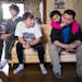 Minnehaha Academy students Daniel Rose, from left, 14, and Peter Shaffer, 14, hang out with Ken Vue and his daughter Diav Vue, 7, while staying at the
