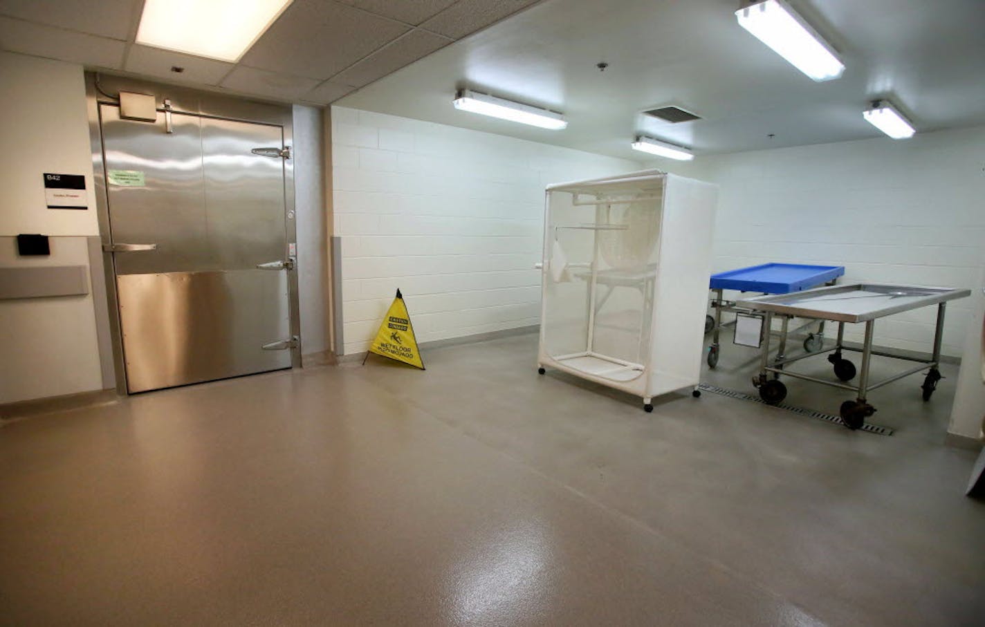 Autopsy tables outside the cooler/freezer where bodies are kept for autopsy, sometimes pending identification at the Hennepin County Medical Examiner's office in June 2015.