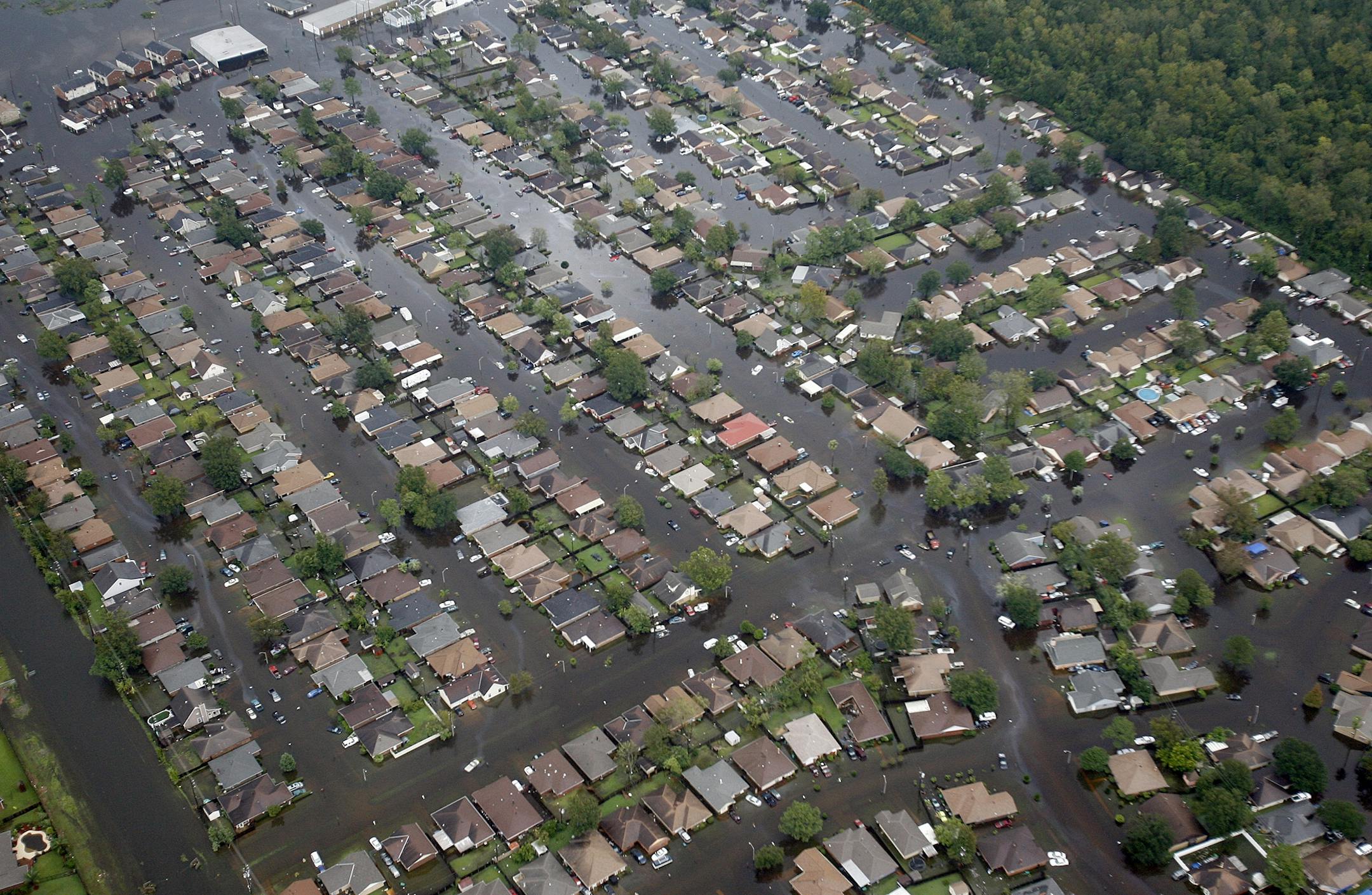 Homes in LaPlace, La., west of US 51 and south of I-10, are covered in floodwaters in the aftermath of Isaac on Thursday, Aug. 30, 2012. Isaac hovered over Louisiana for a third day Thursday, shedding more than a foot of additional rain that forced authorities to hurriedly evacuate areas ahead of the storm and rescue hundreds of people who could not escape as the rapidly rising waters swallowed entire neighborhoods. (AP Photo/The Times-Picayune, Michael Democker) MAGS OUT; NO SALES; USA TODAY OU