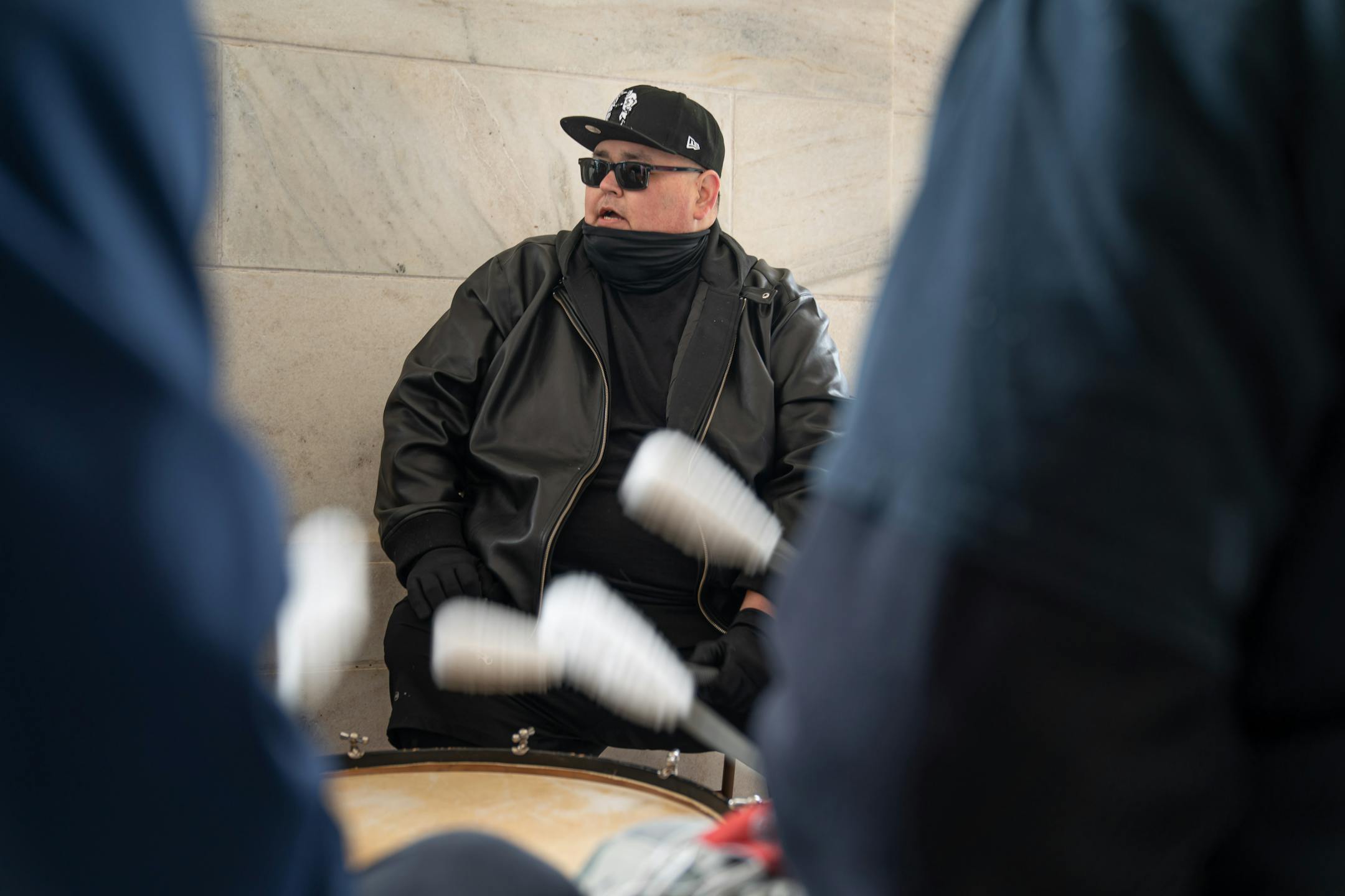 Crow Bellecourt, Clyde Bellecourt's son, led singing by the drum group Midnite Express outside the Capitol.