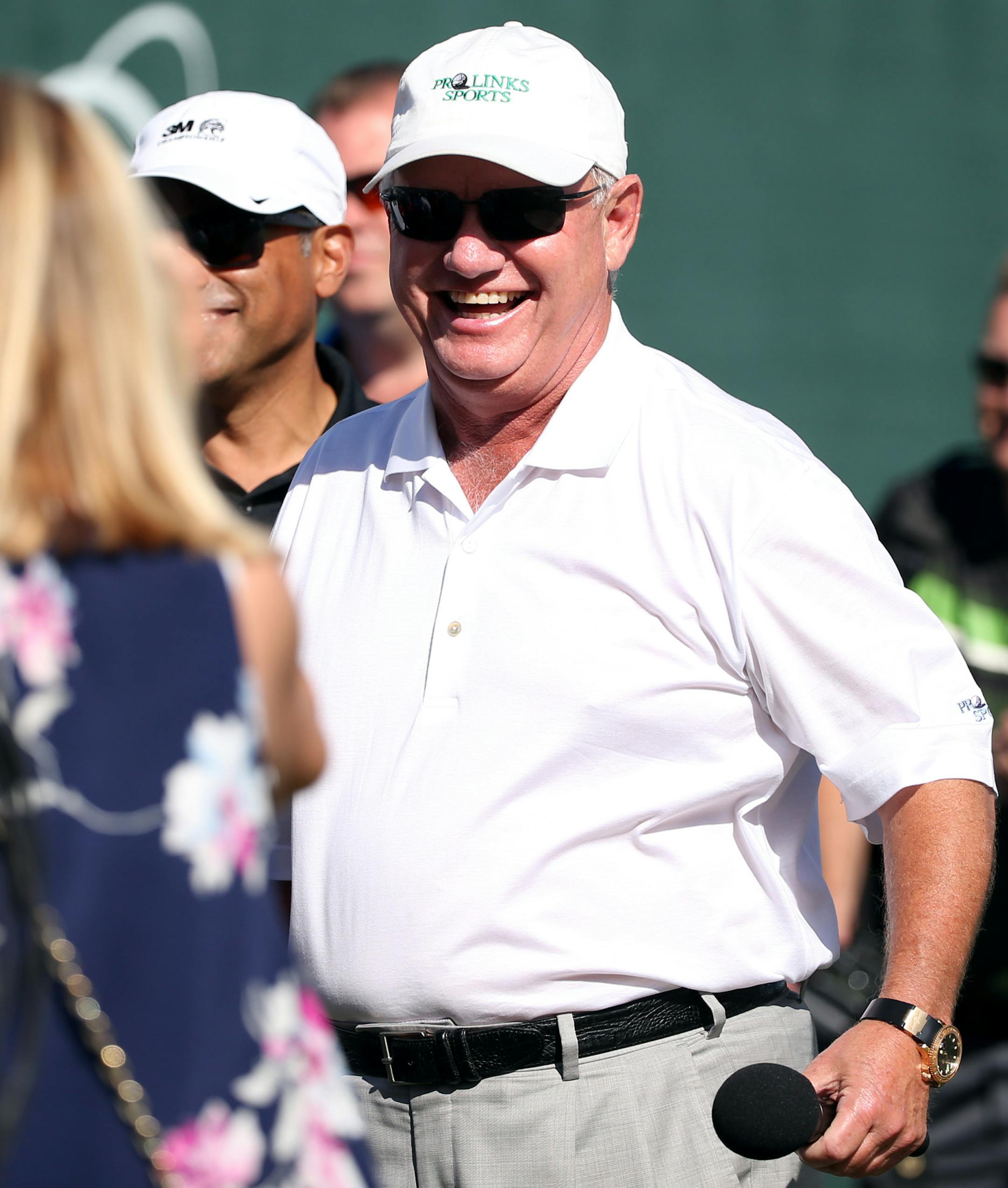 Hollis Cavner, the 3M Championship boss, caught up with Sandy Perry, wife of winner Kenny Perry, after the final round.