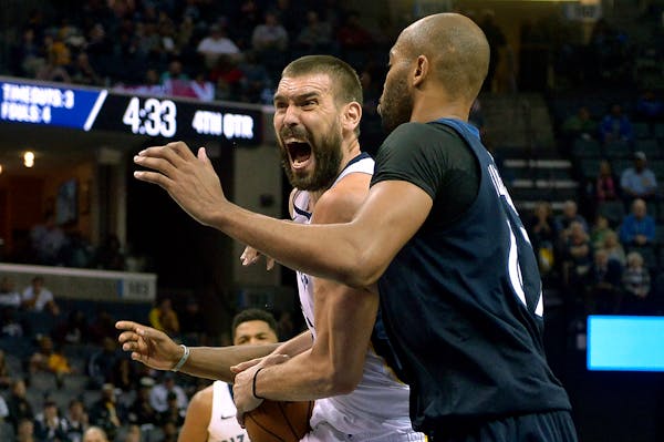 Grizzlies center Marc Gasol drove against Timberwolves forward Taj Gibson in the second half Monday. Gasol scored 21 points in Memphis' 95-92 victory.