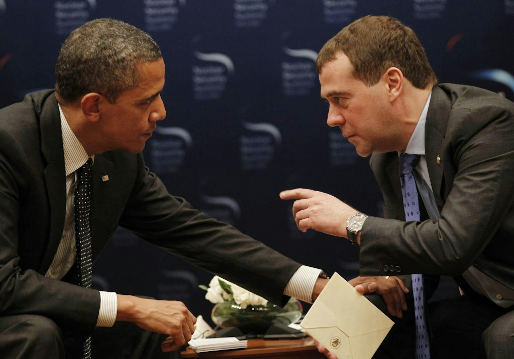 U.S. President Barack Obama, left, chats with Russian President Dmitry Medvedev during a bilateral meeting at the Nuclear Security Summit in Seoul, South Korea, Monday.