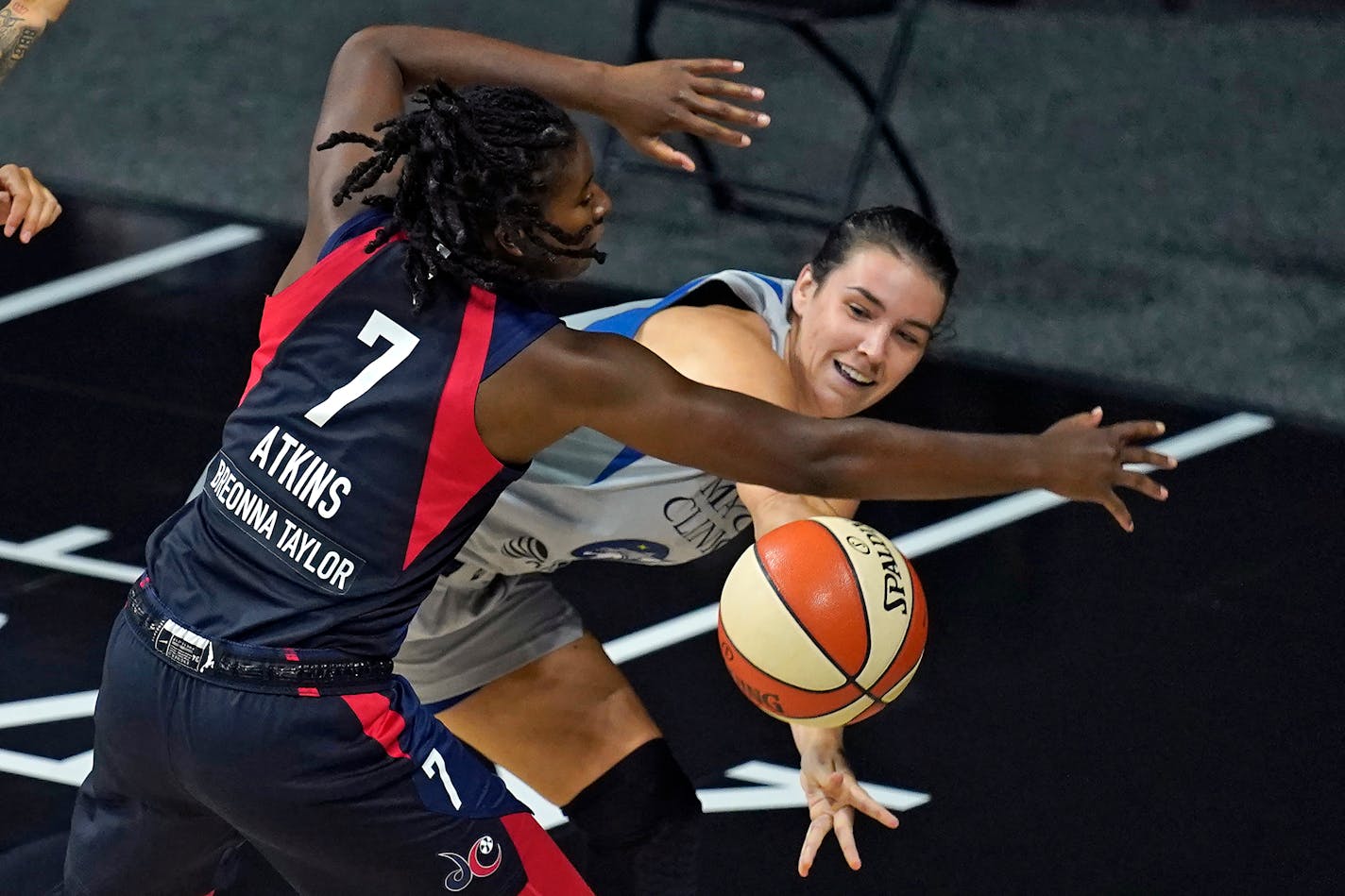 Lynx guard Bridget Carleton moves the ball around Washington Mystics guard Ariel Atkins on Sept. 8