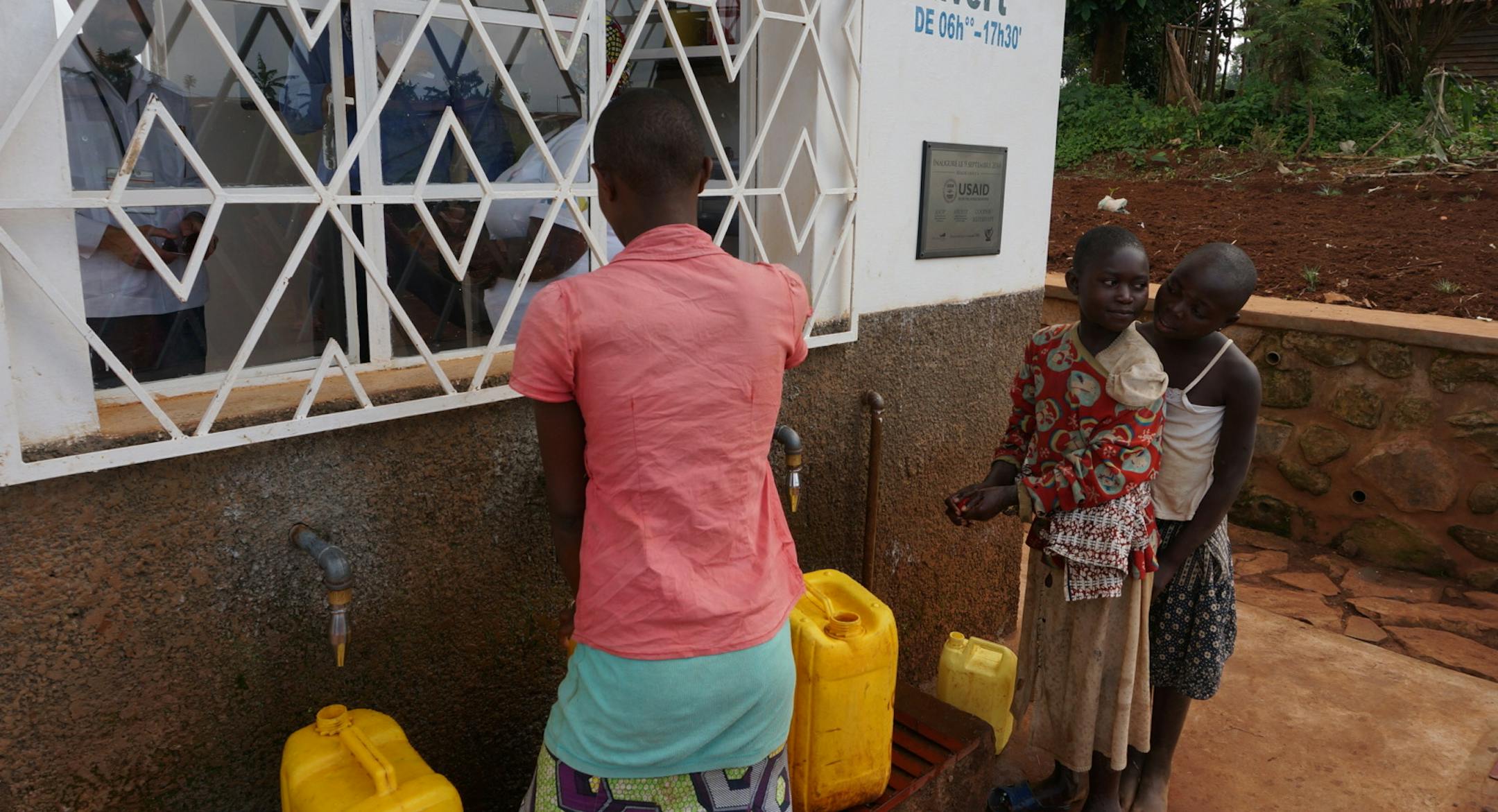 Villagers in the first "Asili" social-enterprise zone in the eastern part of the Democratic Republic of Congo buy water from workers at a community-owned clean-water station, part of several water, healthcare and small-farm enterprises designed to boost incomes of hundreds of involved families in what has been a war-torn, impovershed area. The sponsors in the first community-owned enterprise district include Minneapolis businessman and philanthopist Ward Brehm, Minneapolis-based American Refugee