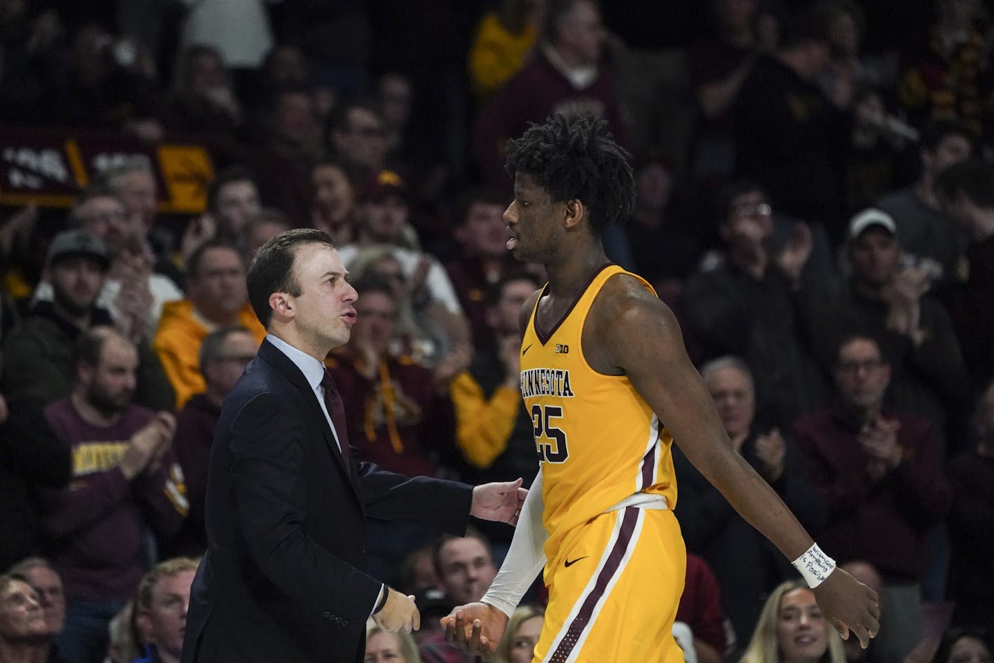 Minnesota Gophers center Daniel Oturu (25) walked past Minnesota Gophers head coach Richard Pitino after he fouled out in the second half. ] RENEE JONES SCHNEIDER &#xa5; renee.jones@startribune.com The Minnesota Gophers hosted the Wisconsin Badgers at Williams Arena at the University of Minnesota in Minneapolis, Minn., on Wednesday, February 5, 2020.