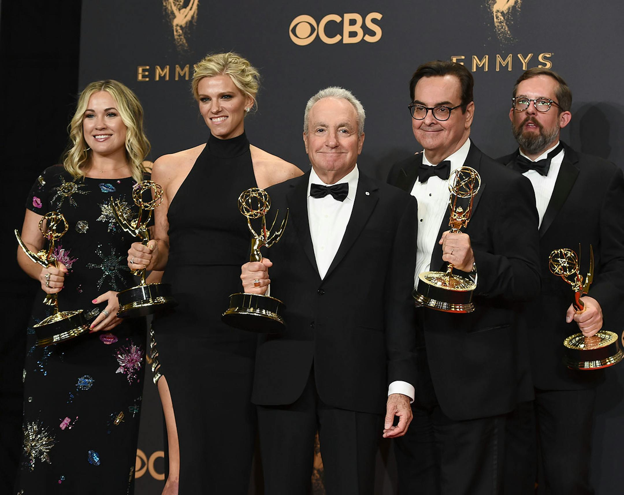 Lorne Michaels, center, and the team from "Saturday Night Live" pose in the press room with their awards for outstanding variety sketch poses at the 69th Primetime Emmy Awards on Sunday, Sept. 17, 2017, at the Microsoft Theater in Los Angeles.