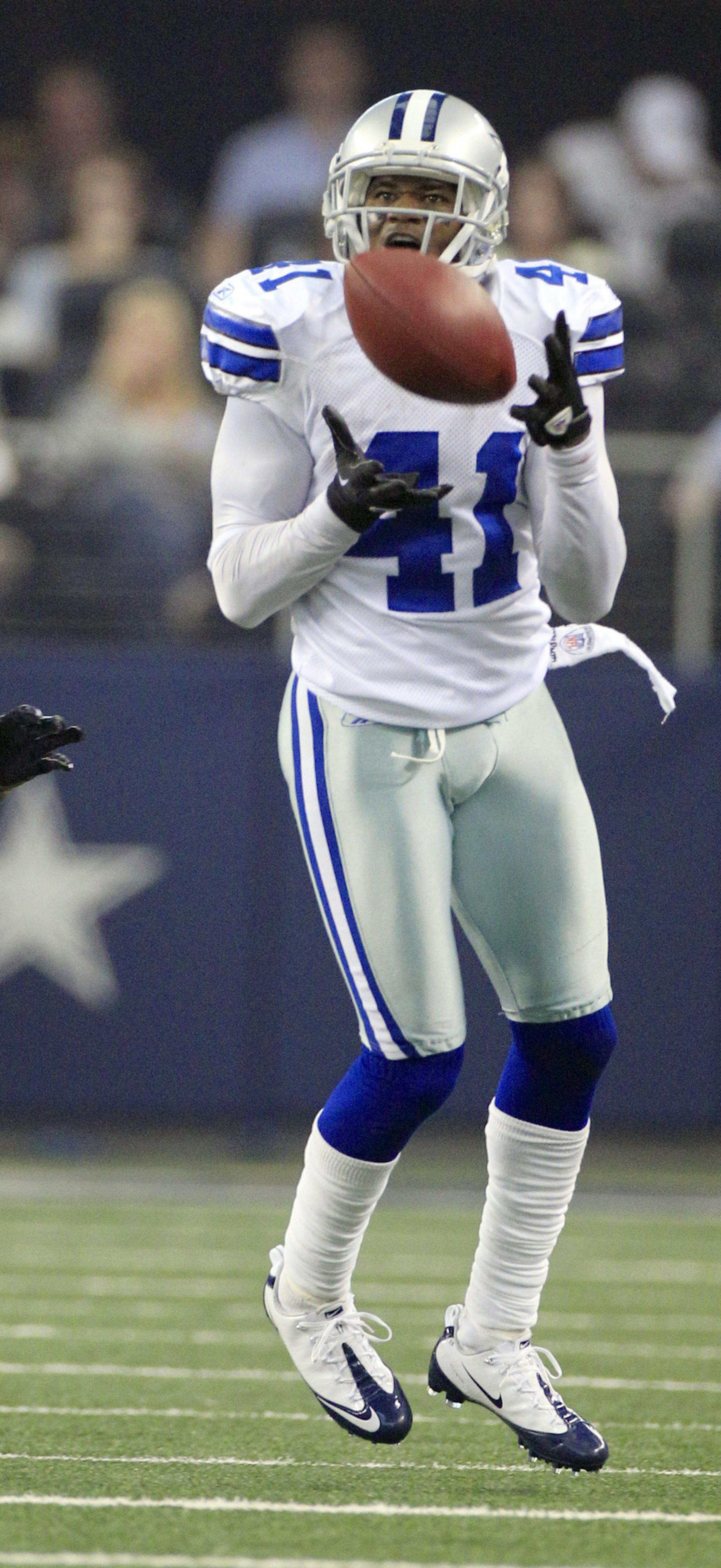 Dallas Cowboys' Terence Newman, right, intercepts a ball in front of Seattle Seahawks' Sidney Rice during second half of an NFL football game on Sunday, Nov. 6, 2011, in Arlington, Texas. (AP Photo/Tony Gutierrez) ORG XMIT: CBS145