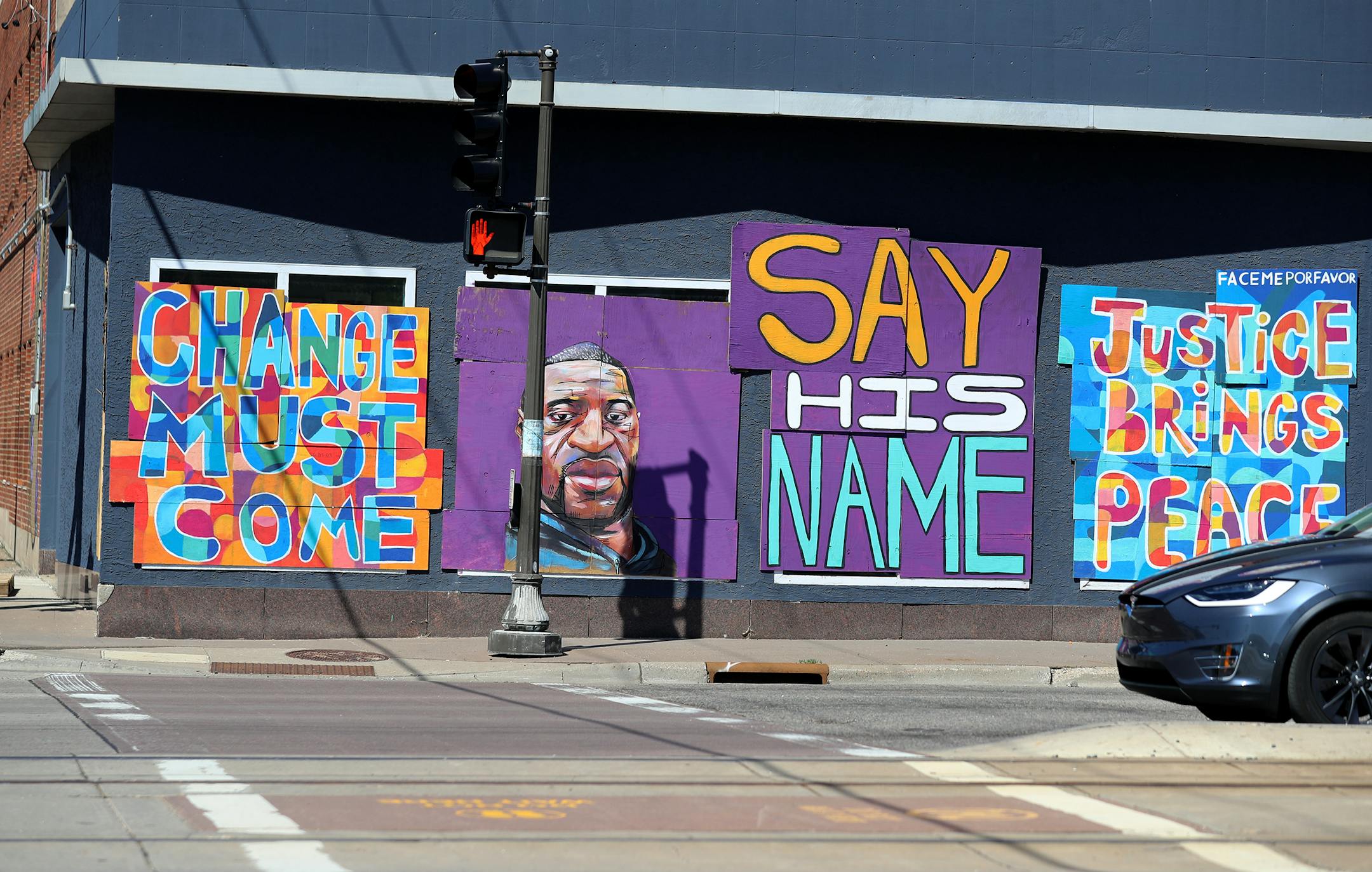 Four murals by the street artist collective Face Me Por Favor on the 2100 block of University Ave. W. in St. Paul focus on social justice in the wake of George Floyd's death in police custody.
