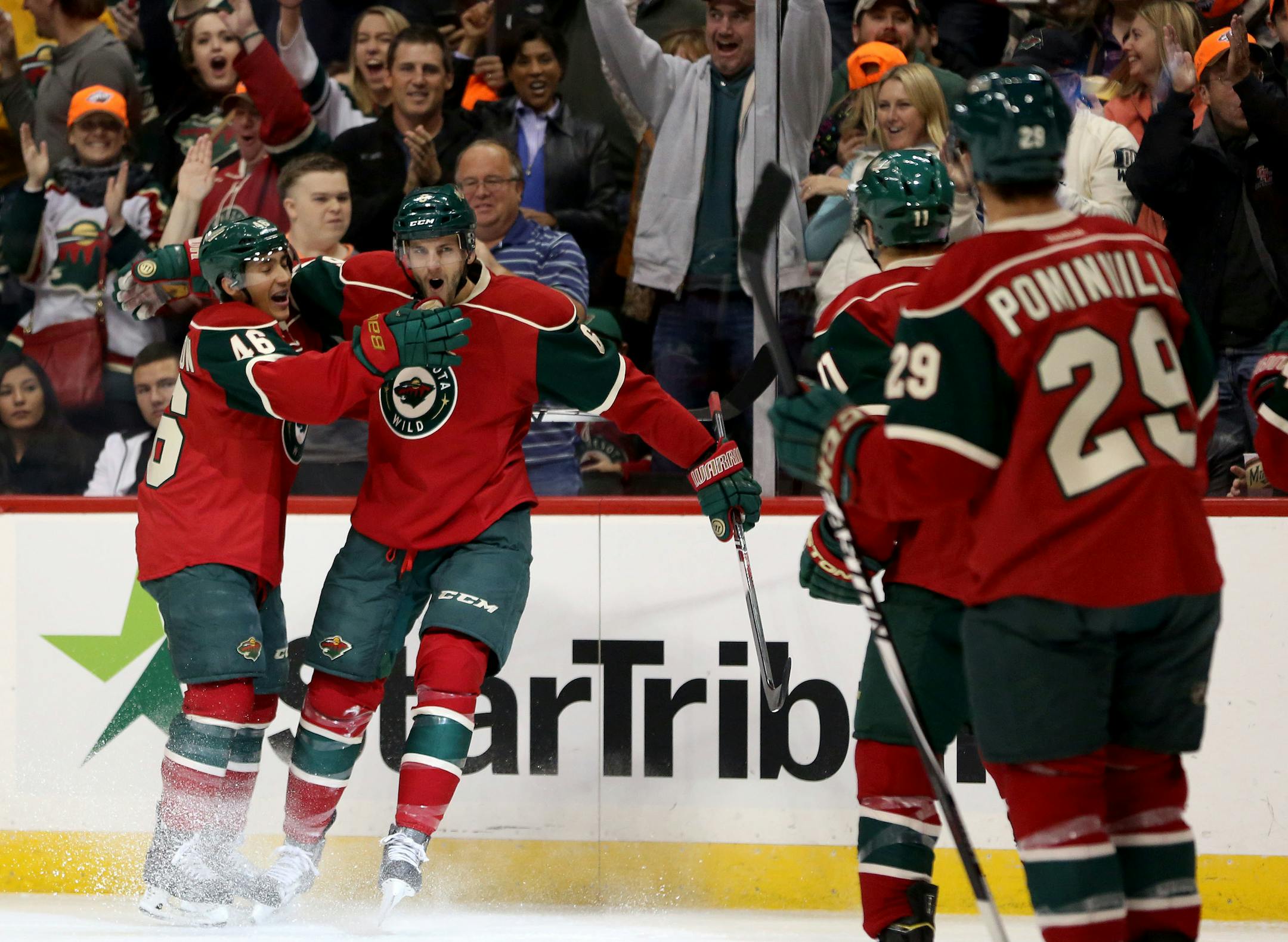 The Wild's Marco Scandella celebrated scoring the the team's first goal Saturday with teammate Jared Spurgeon during the first period.
