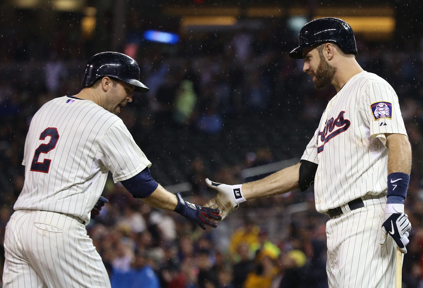 Twins Brain Dozier celebrated with Joe Mauer after hitting a solo homerun in the fourth inning. ] (KYNDELL HARKNESS/STAR TRIBUNE) kyndell.harkness@startribune.com Twins vs Cleveland at Target Field in Minneapolis Min., Wednesday September 23, 2015.