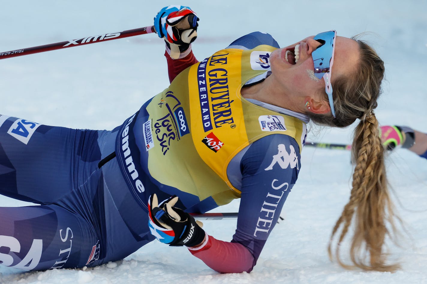 United States's Jessie Diggins celebrates winning the cross-country ski, women's Tour de Ski overall standings, in Val di Fiemme, Italy, Sunday, Jan. 7, 2024. (AP Photo/Alessandro Trovati)