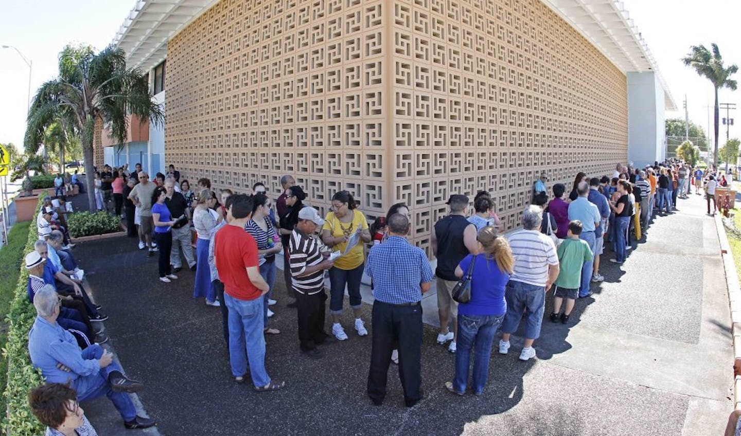 South Florida voters line up to vote at the John F. Kennedy Library in Hialeah, Fla., Saturday, Oct. 27, 2012. Special polling places opened throughout the state Saturday and will be open daily for the next week. Poll times vary by county. This year's early voting period is shorter than in previous elections. Voting rights groups concerned about problems with access unsuccessfully challenged the reduced time frame in the courts. Officials say more than 1.1 million Floridians have already cast ba