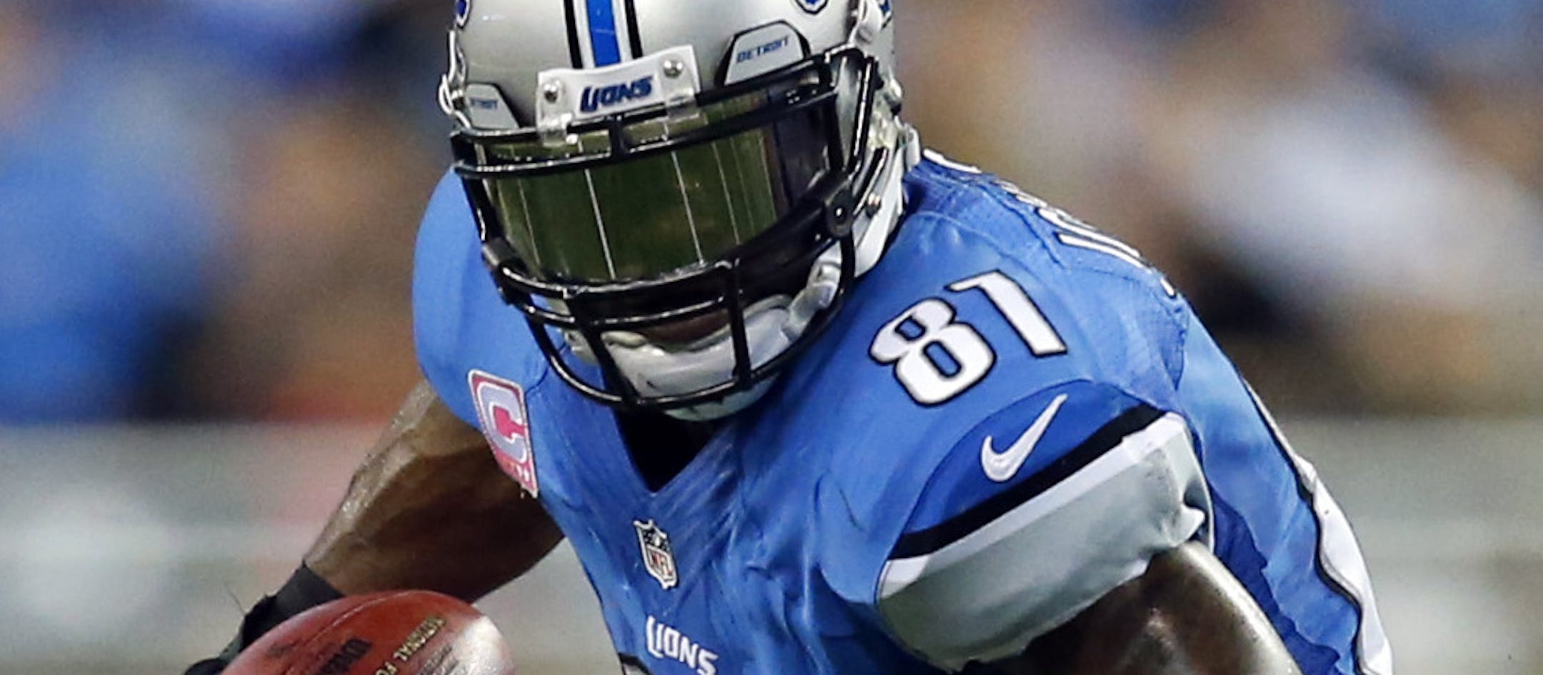 Detroit Lions wide receiver Calvin Johnson (81) catches a ball against the Cincinnati Bengals in the first quarter of an NFL football game against Sunday, Oct. 20, 2013, in Detroit. (AP Photo/Rick Osentoski)