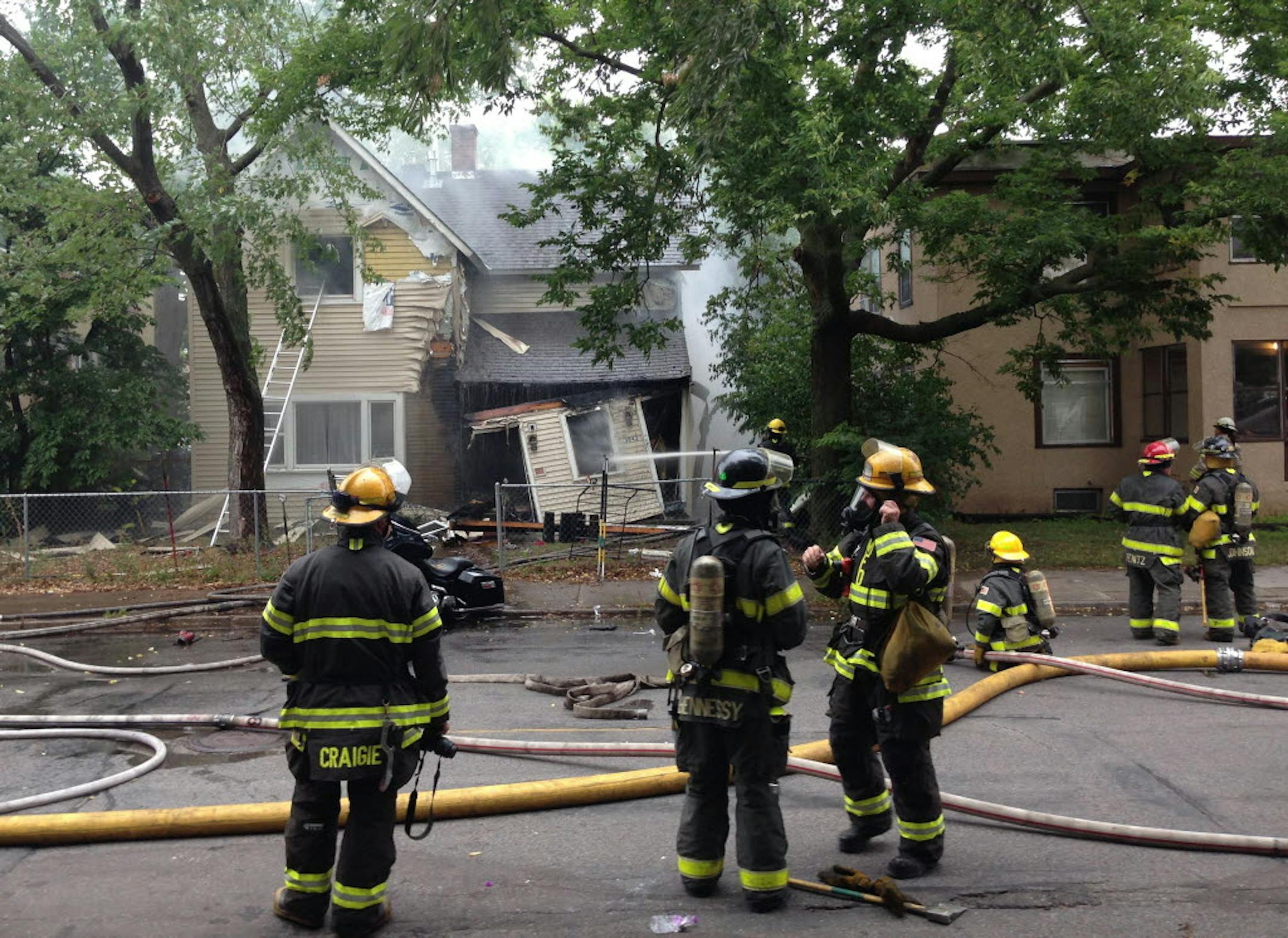 Firefighters battle a fire at 3043 Grand Ave S. in Minneapolis.