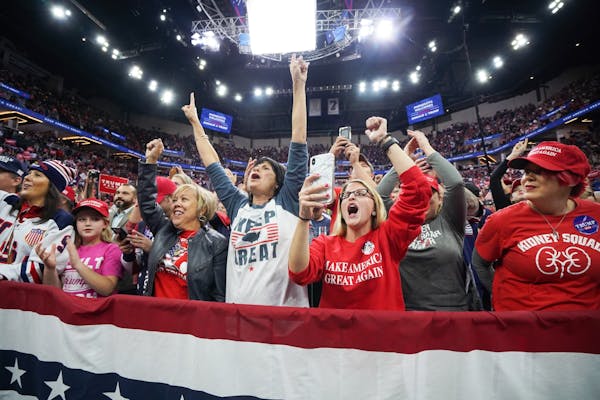President Donald Trump greeted cheering crowds at the Target Center in Minneapolis, Minnesota.